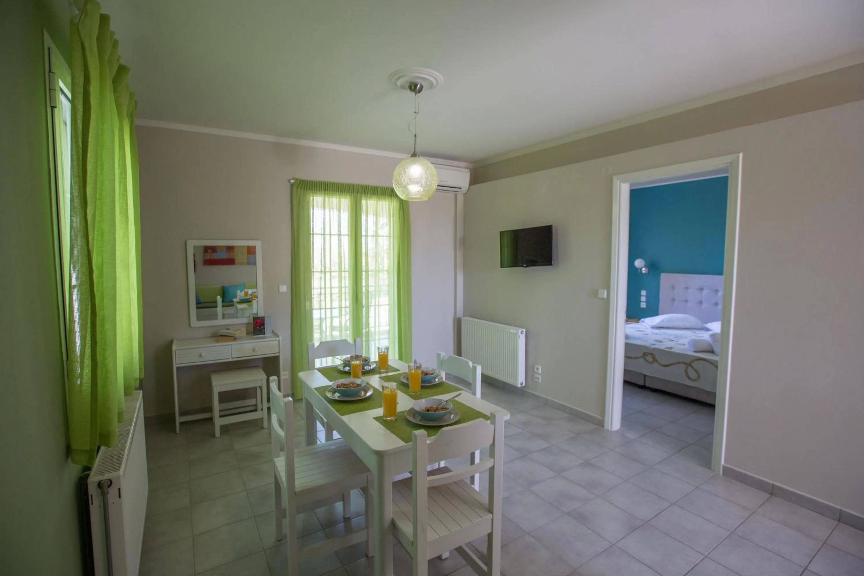 Dining area, Bed in Villa Theodora
