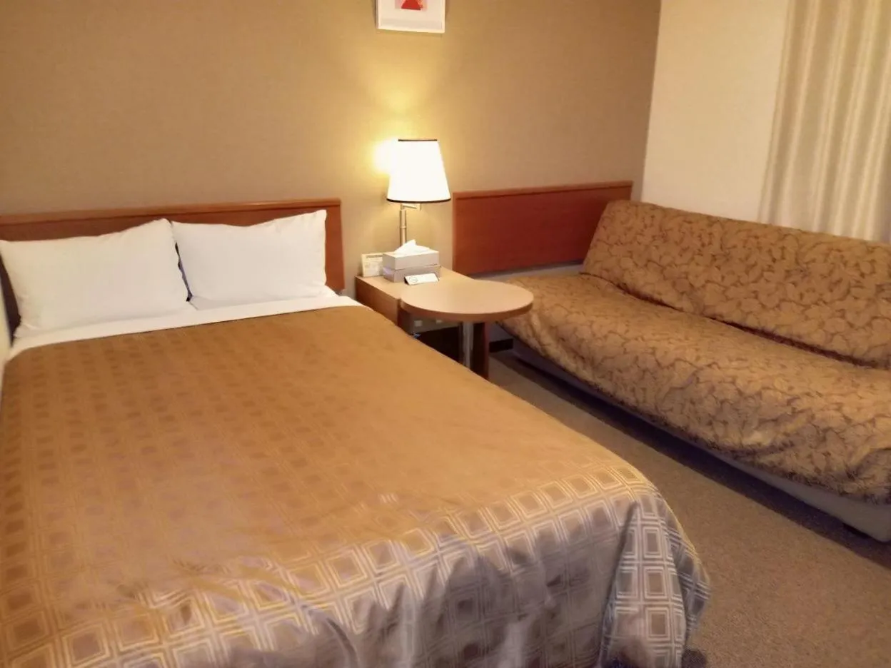 Bed in Ryugasaki Plaza Hotel Shinkan