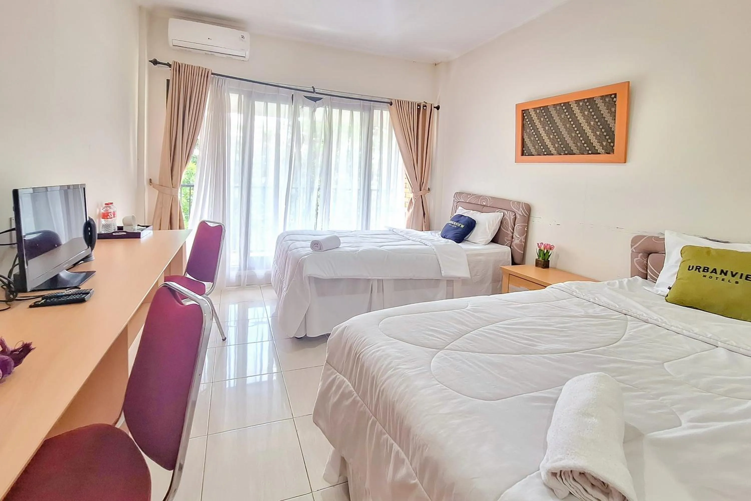 Bedroom, Bed in Urbanview Hotel Tridaya Cisarua Puncak