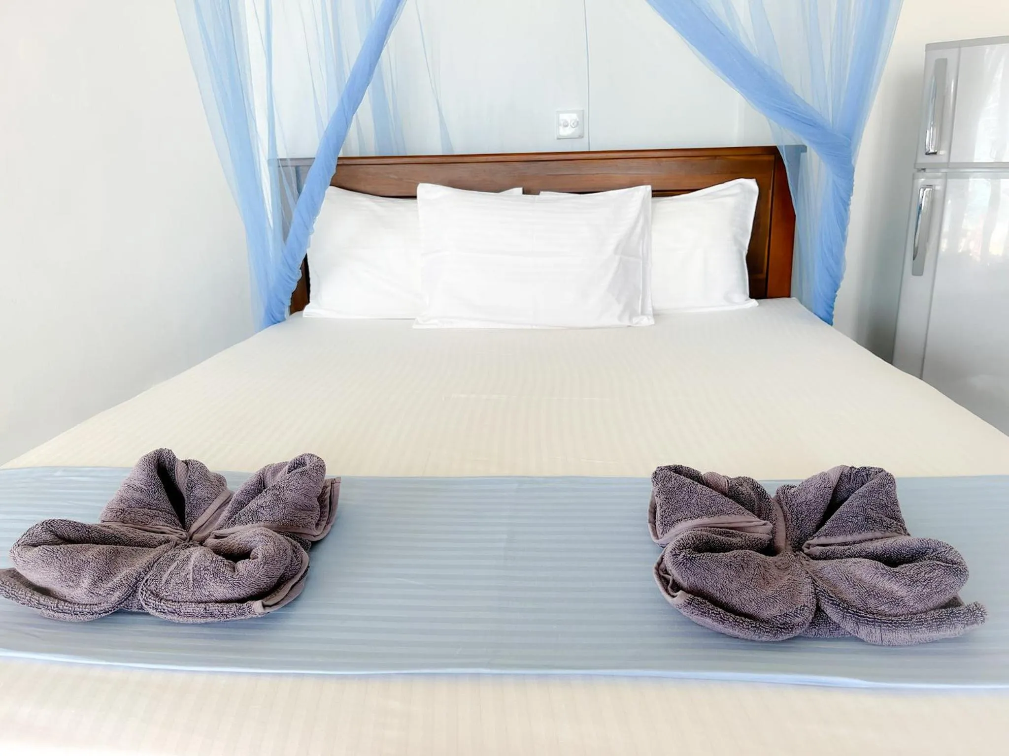 Bed in Pearl Island Beach Hotel
