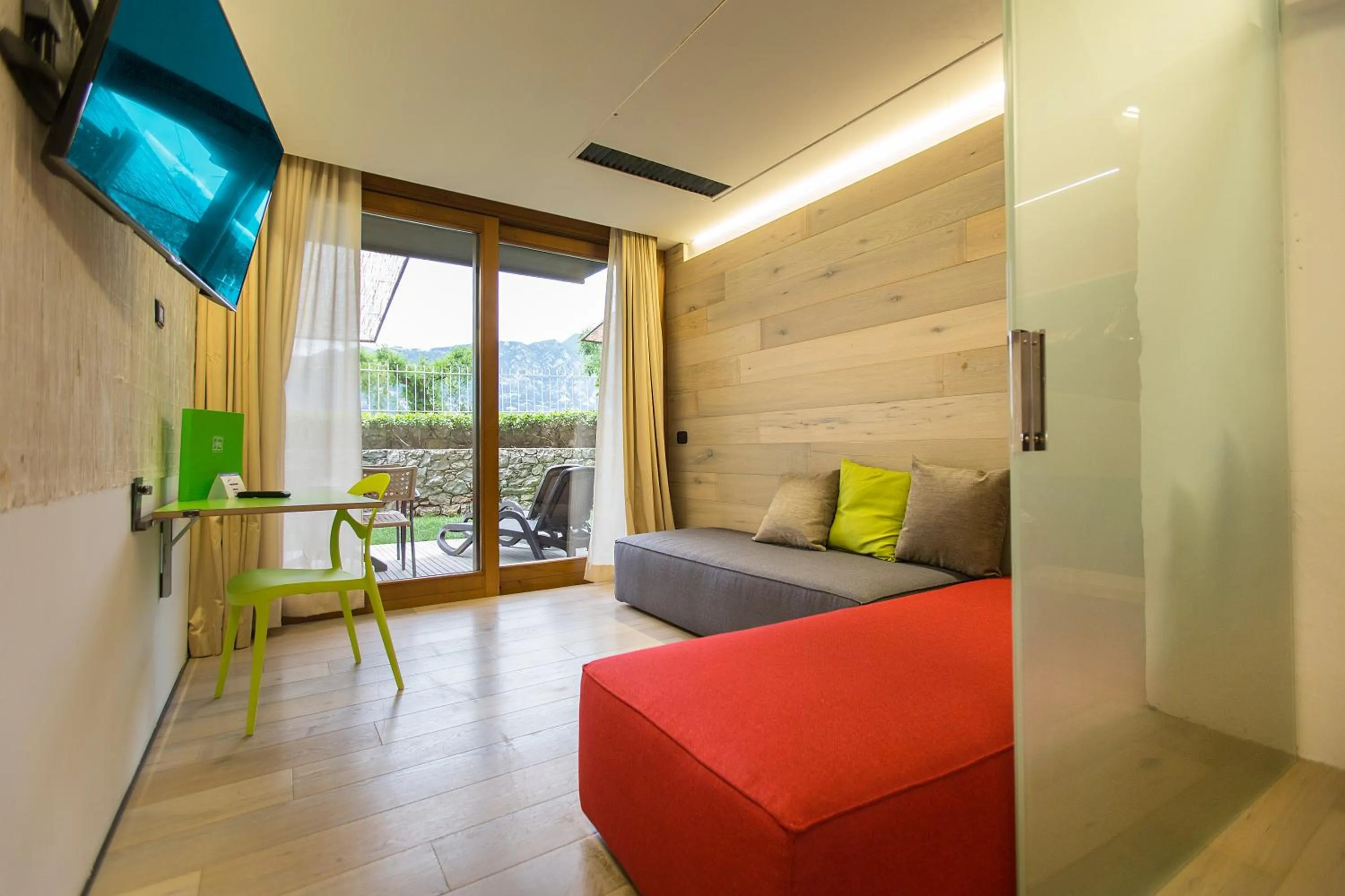 Living room, Bed in Ambienthotel PrimaLuna 3S