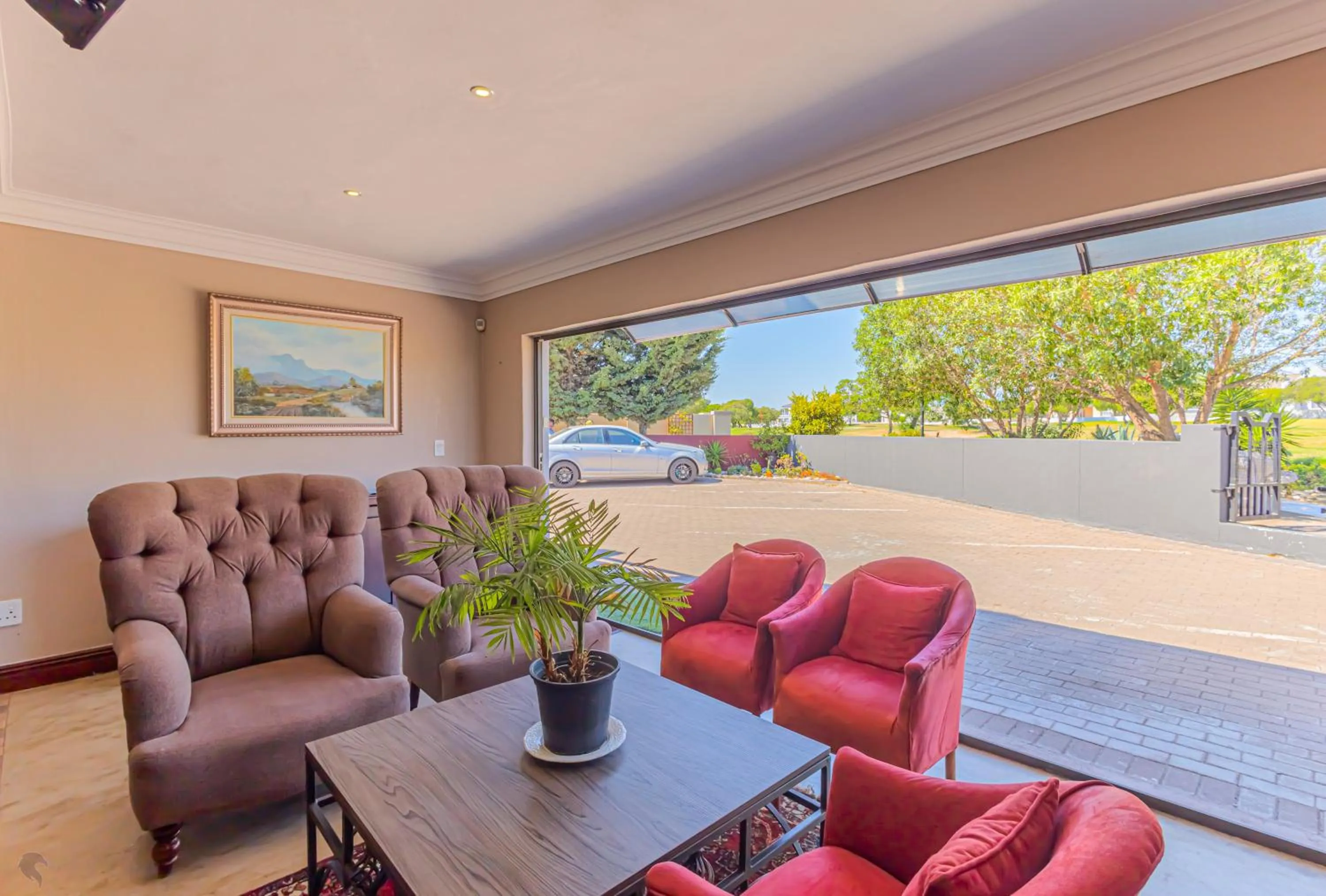 Communal lounge/ TV room in Holiday Guest House Langebaan