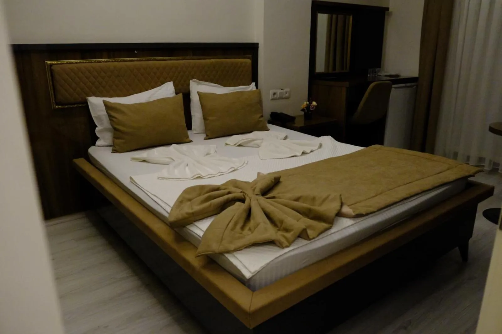 Bed in Grand Diamond Hotel