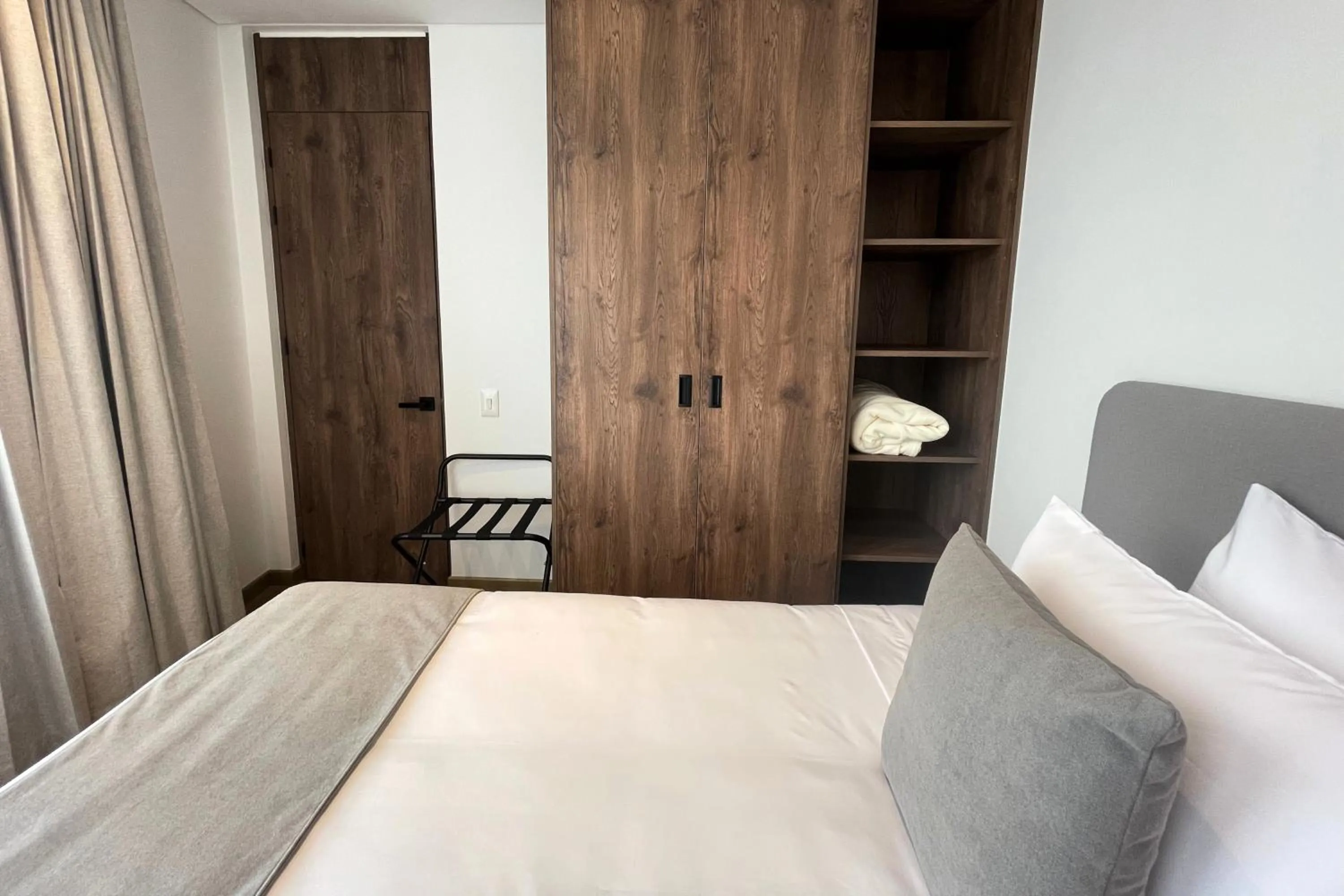 Bed in VOU Suites by Avia Suites