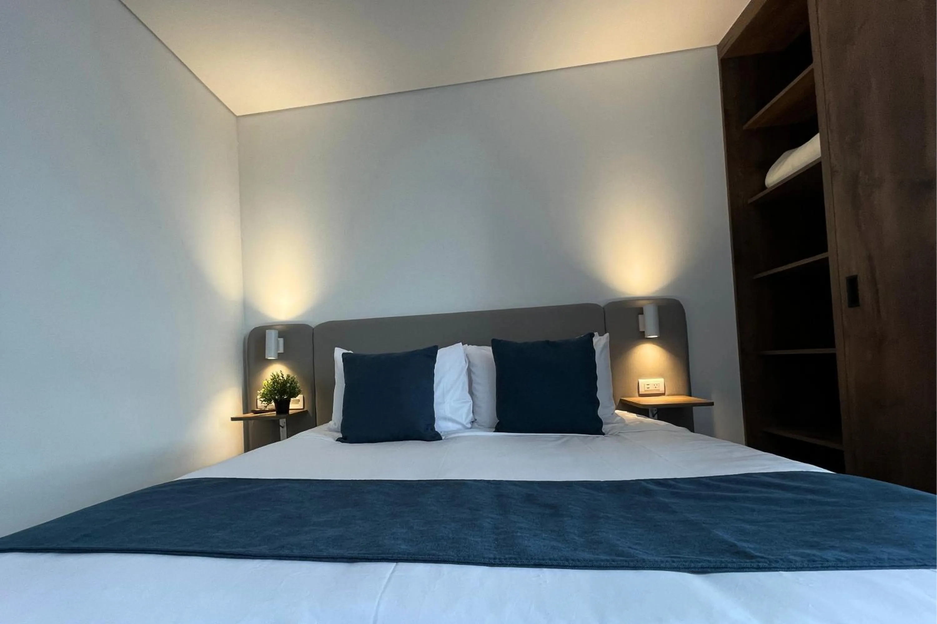 Bed in VOU Suites by Avia Suites