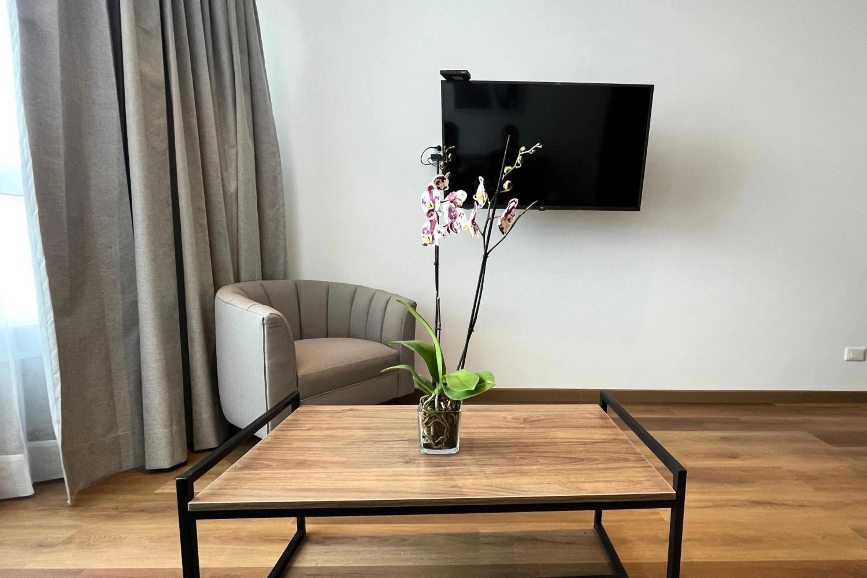 Seating area in VOU Suites by Avia Suites