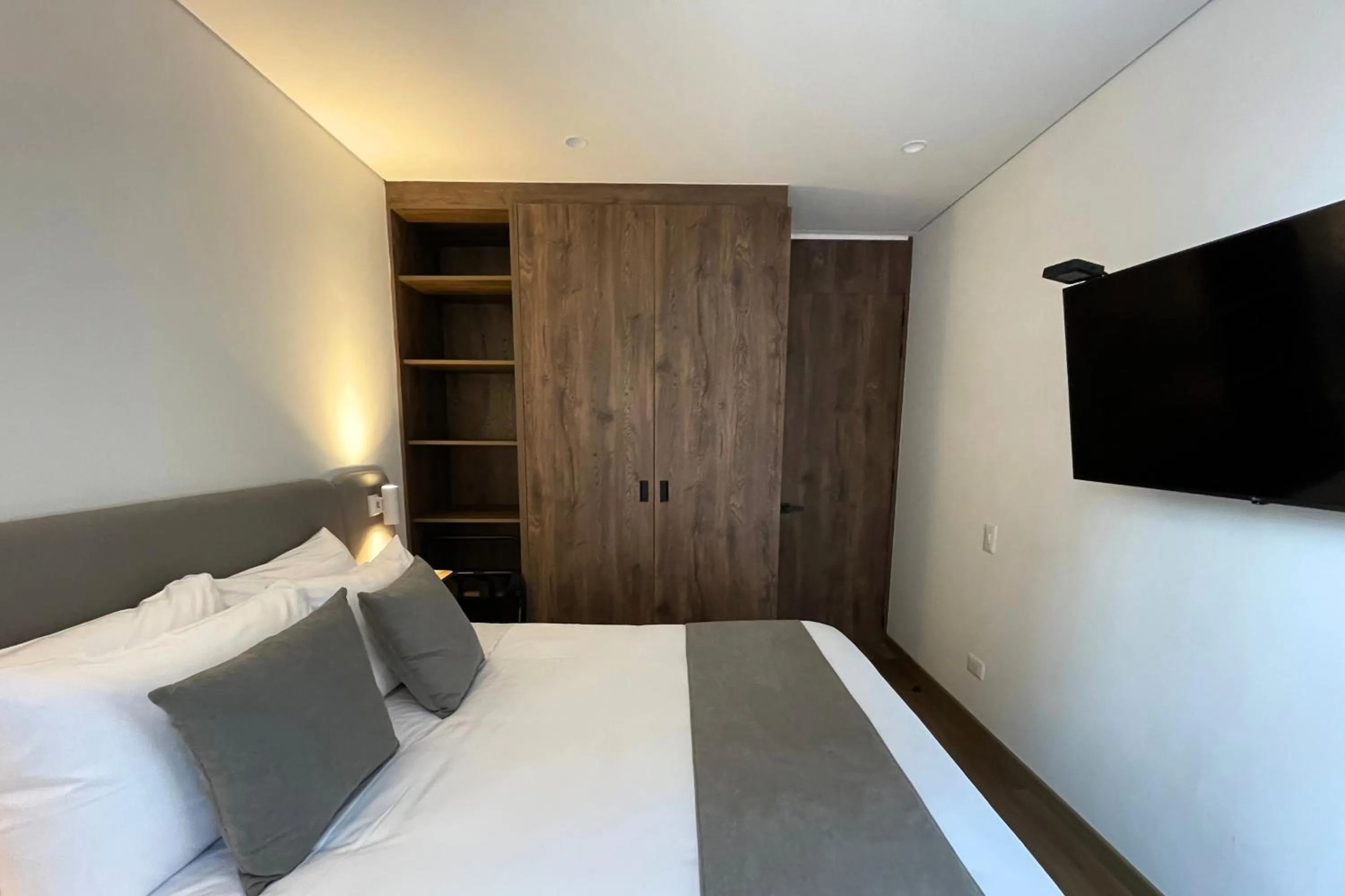 Bed in VOU Suites by Avia Suites