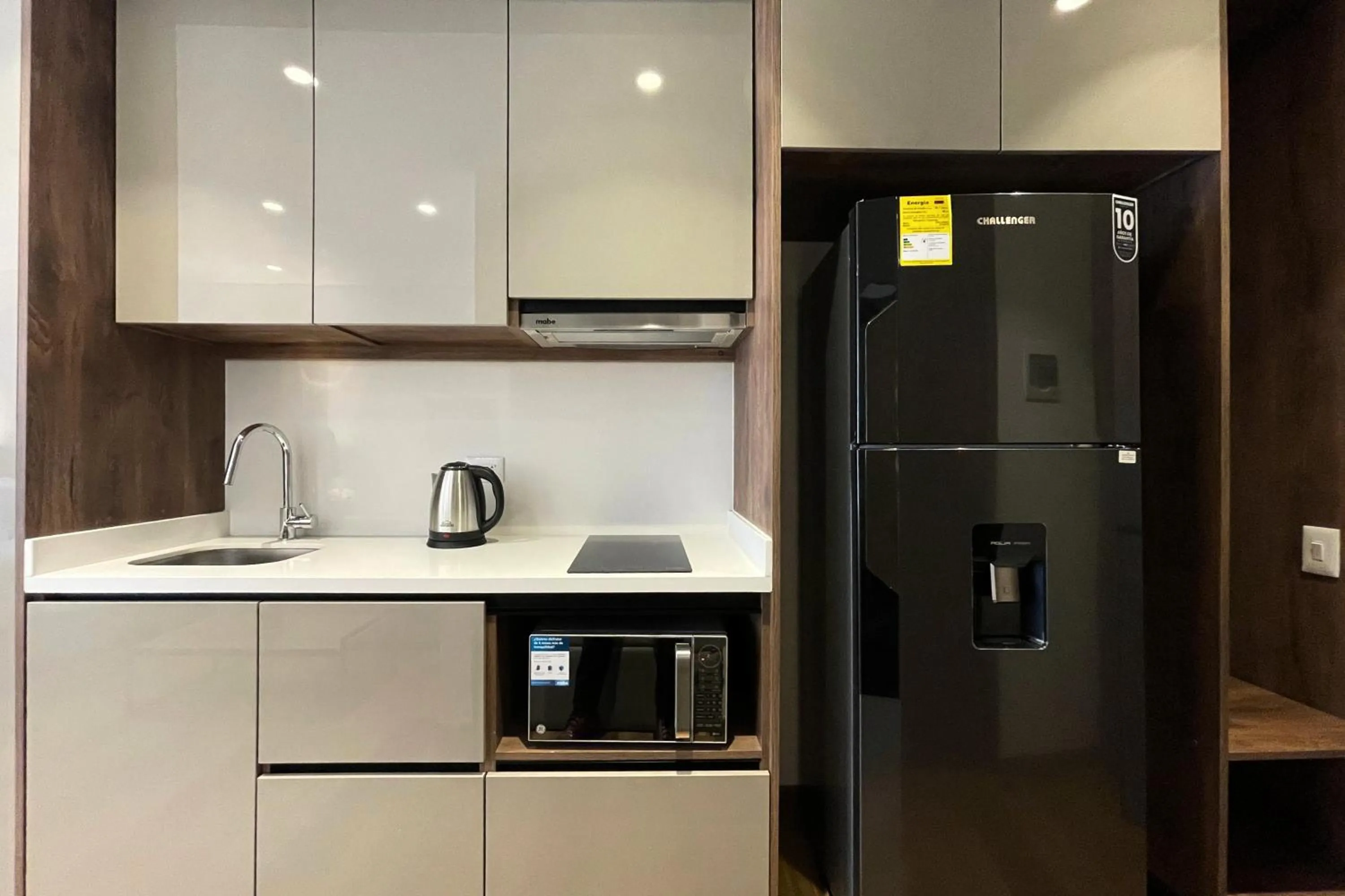 Kitchen or kitchenette in VOU Suites by Avia Suites