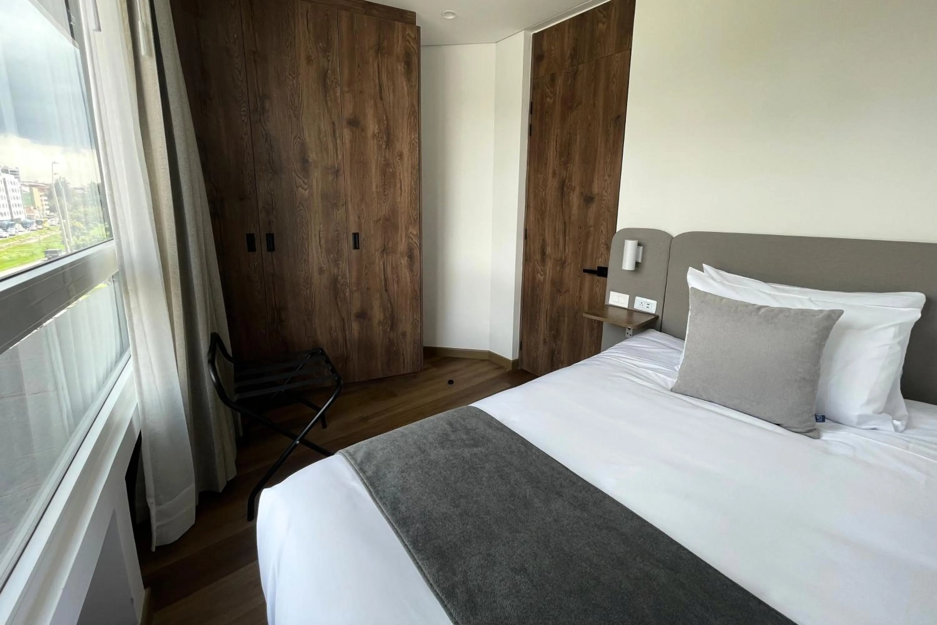 Bed in VOU Suites by Avia Suites