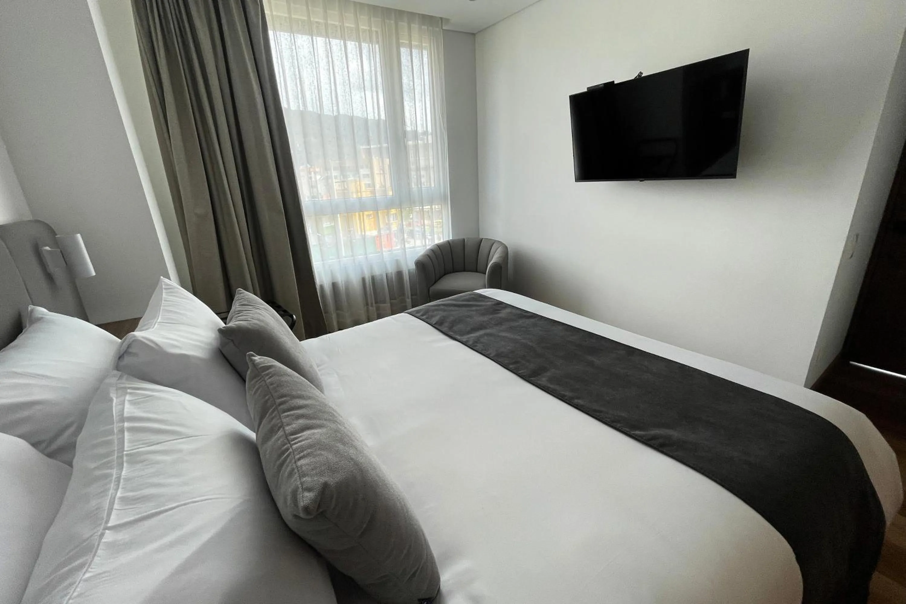 Bed in VOU Suites by Avia Suites