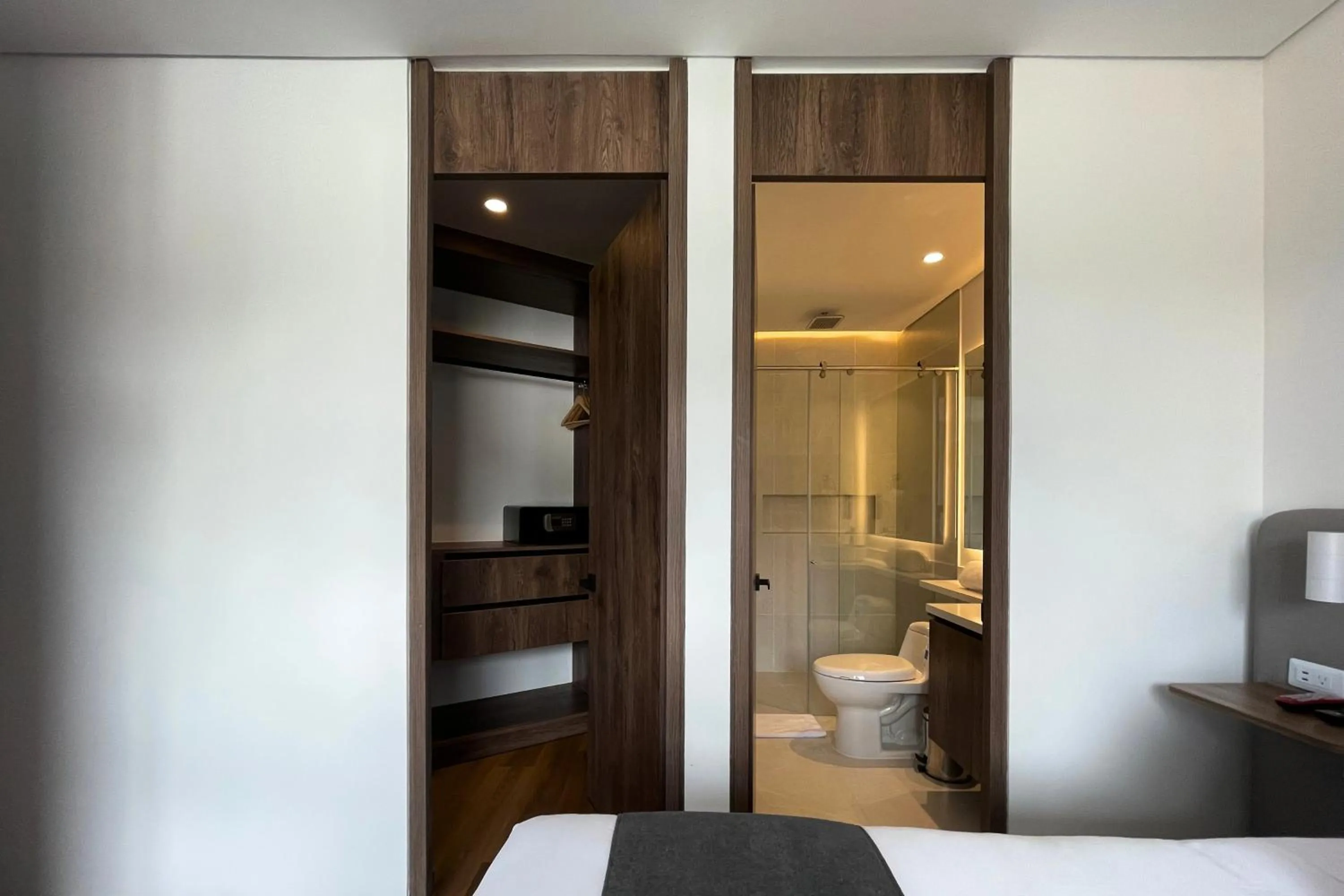 Shower, Bed in VOU Suites by Avia Suites