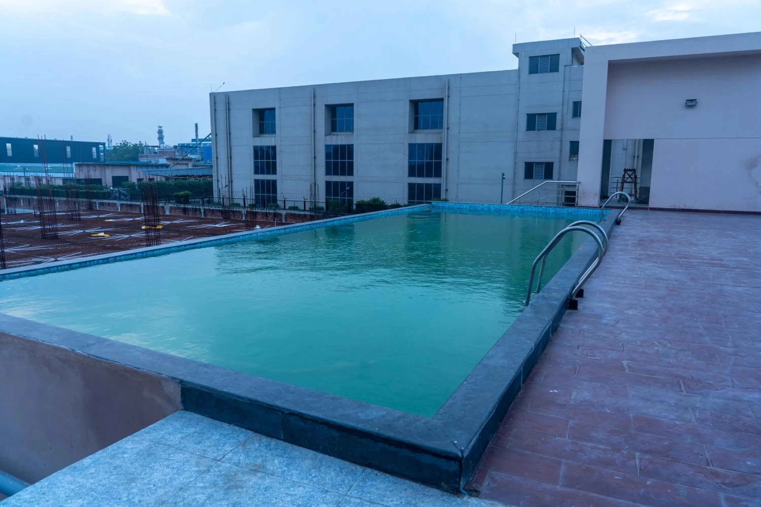 Swimming pool in Ramada Encore By Wyndham Bhiwadi Phool Bagh Chowk