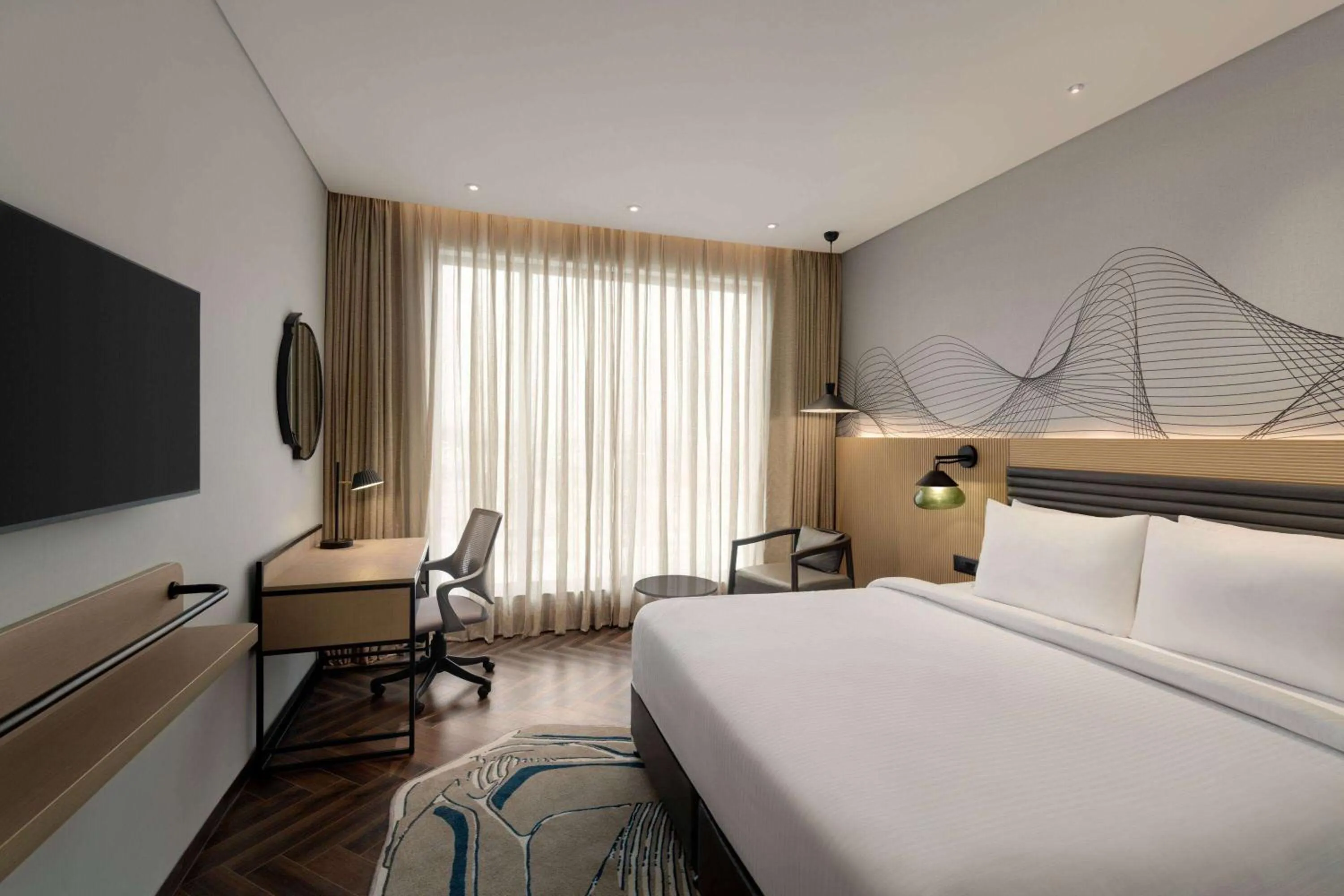 Photo of the whole room, Bed in Ramada Encore By Wyndham Bhiwadi Phool Bagh Chowk