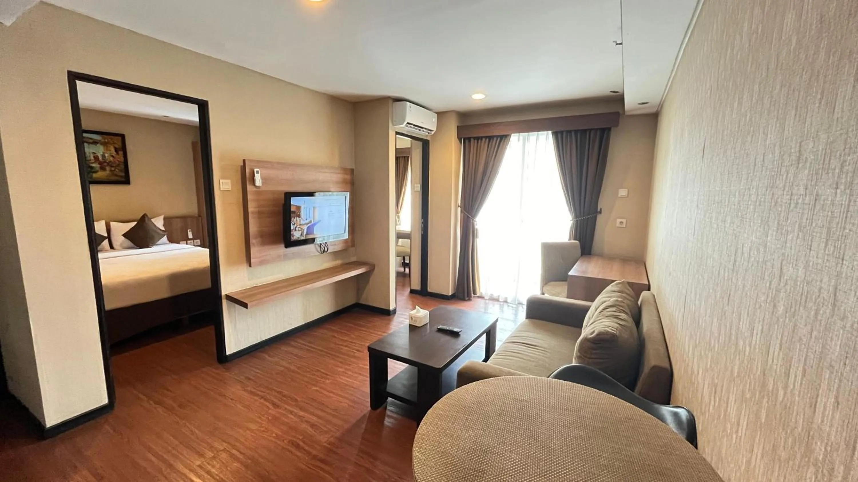 Living room, Bed in Grand Serpong Hotel