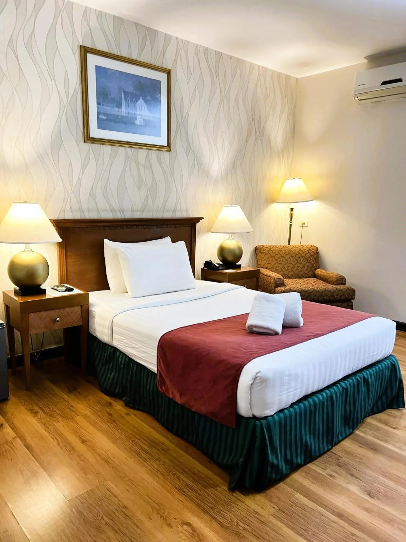 Bed in Royal Suites Condotel