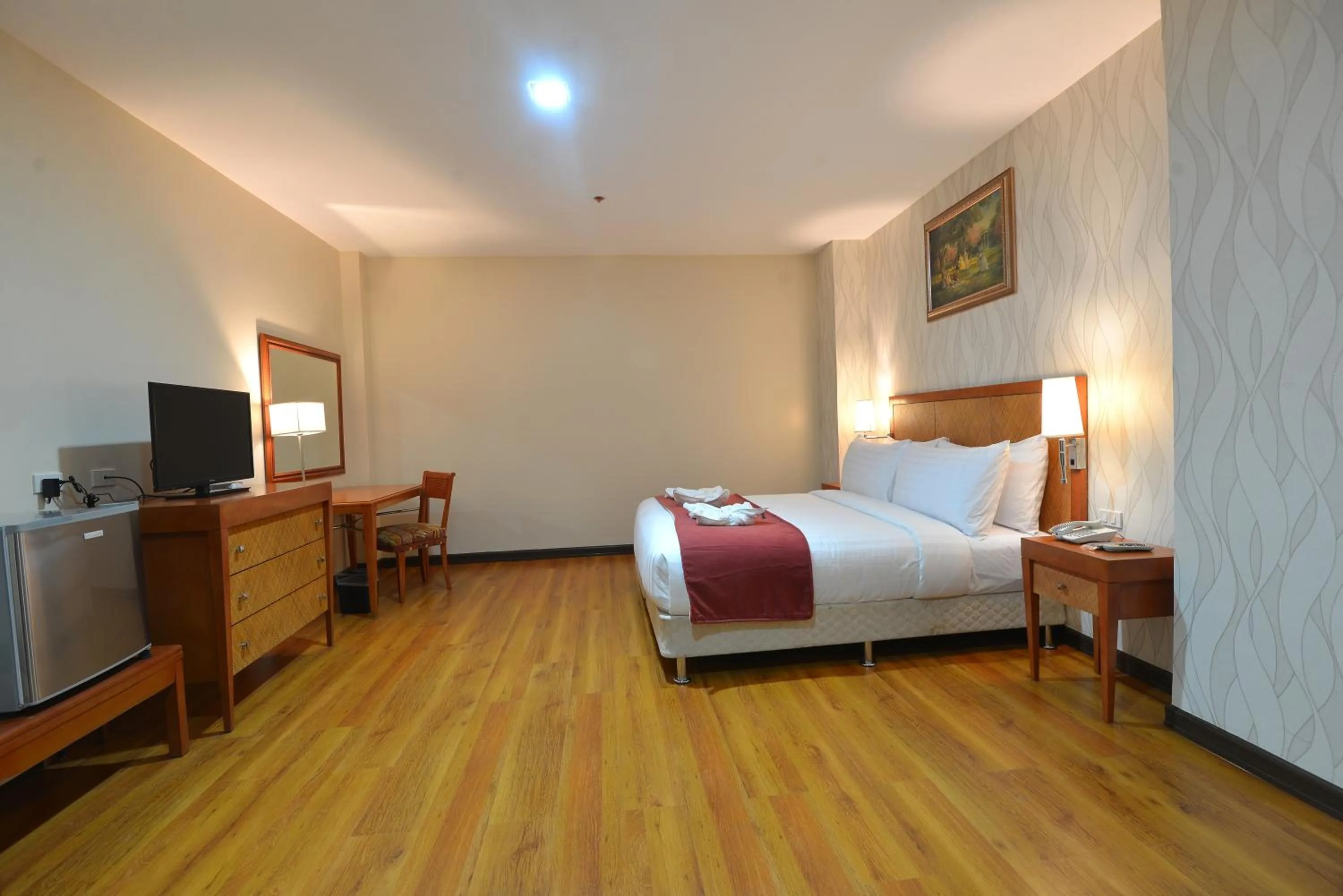 Bed in Royal Suites Condotel