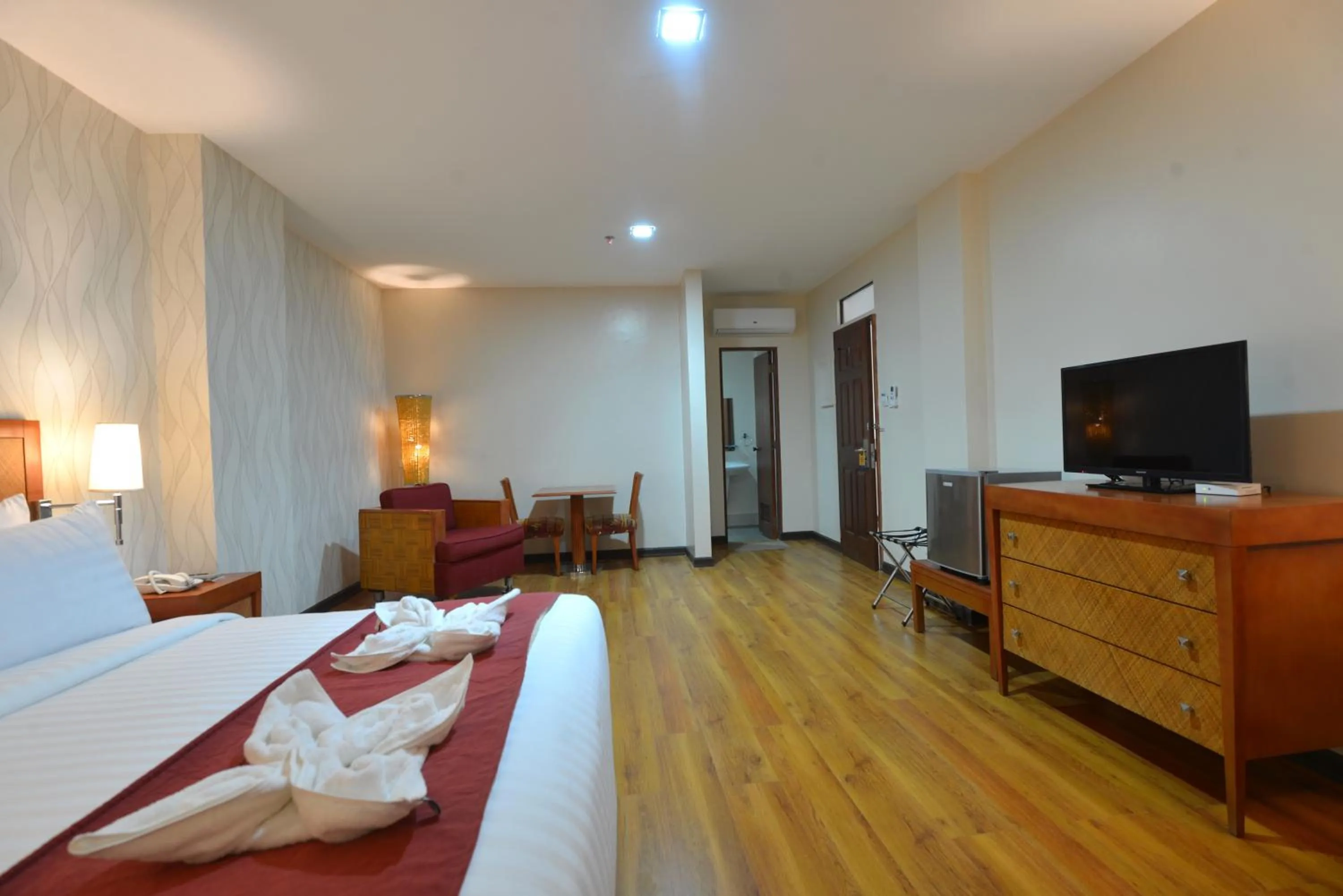 Bed in Royal Suites Condotel