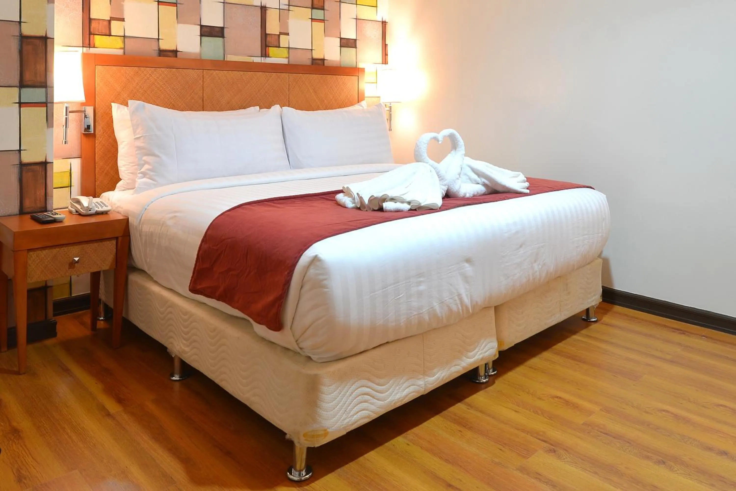 Bed in Royal Suites Condotel