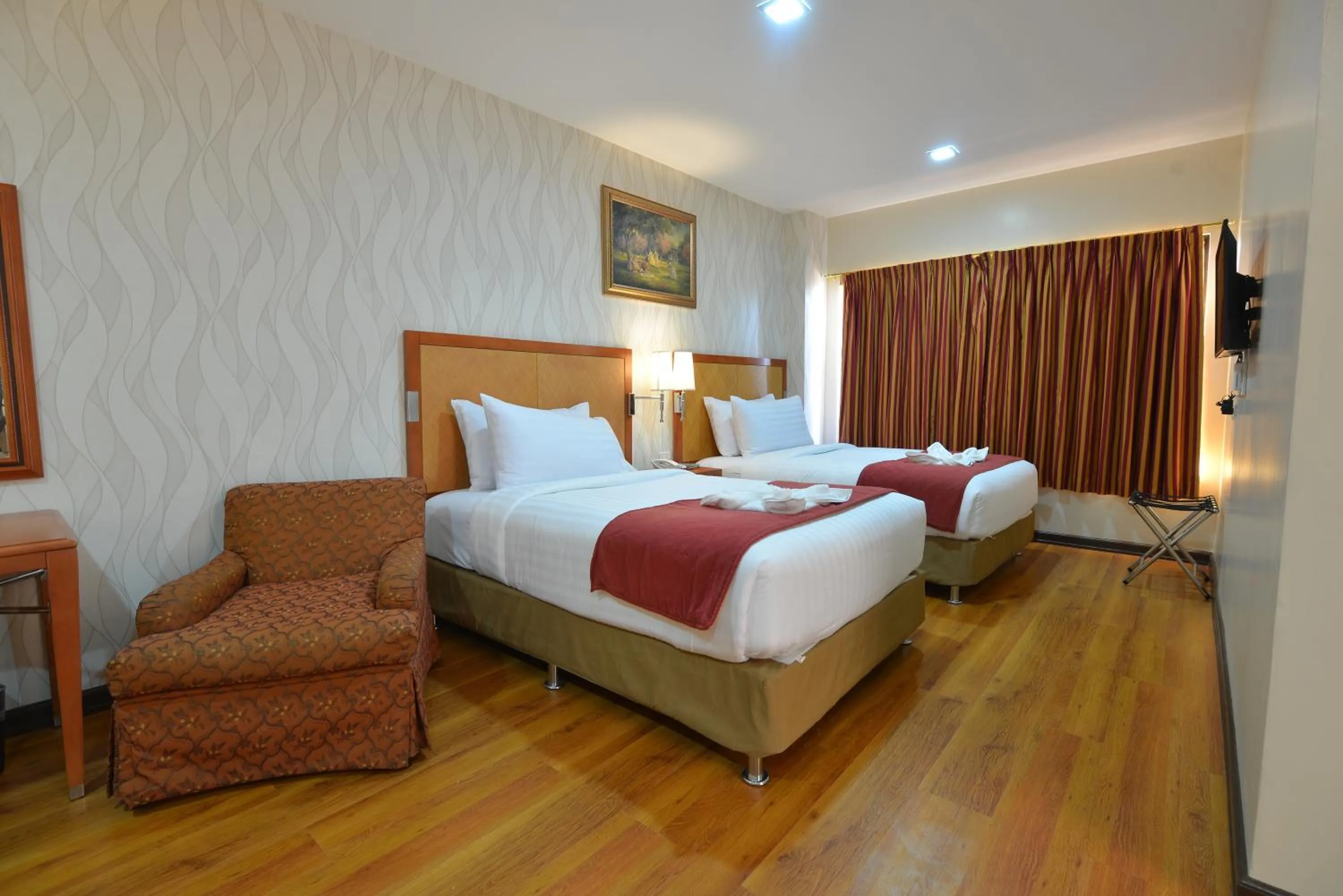 Bed in Royal Suites Condotel