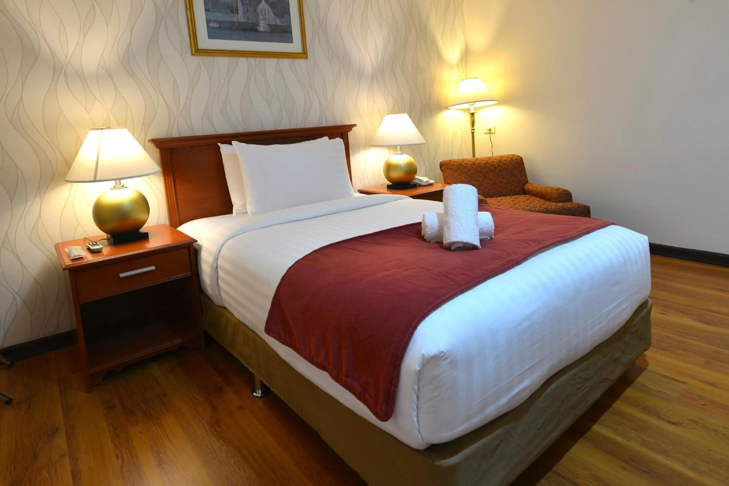 Bed in Royal Suites Condotel