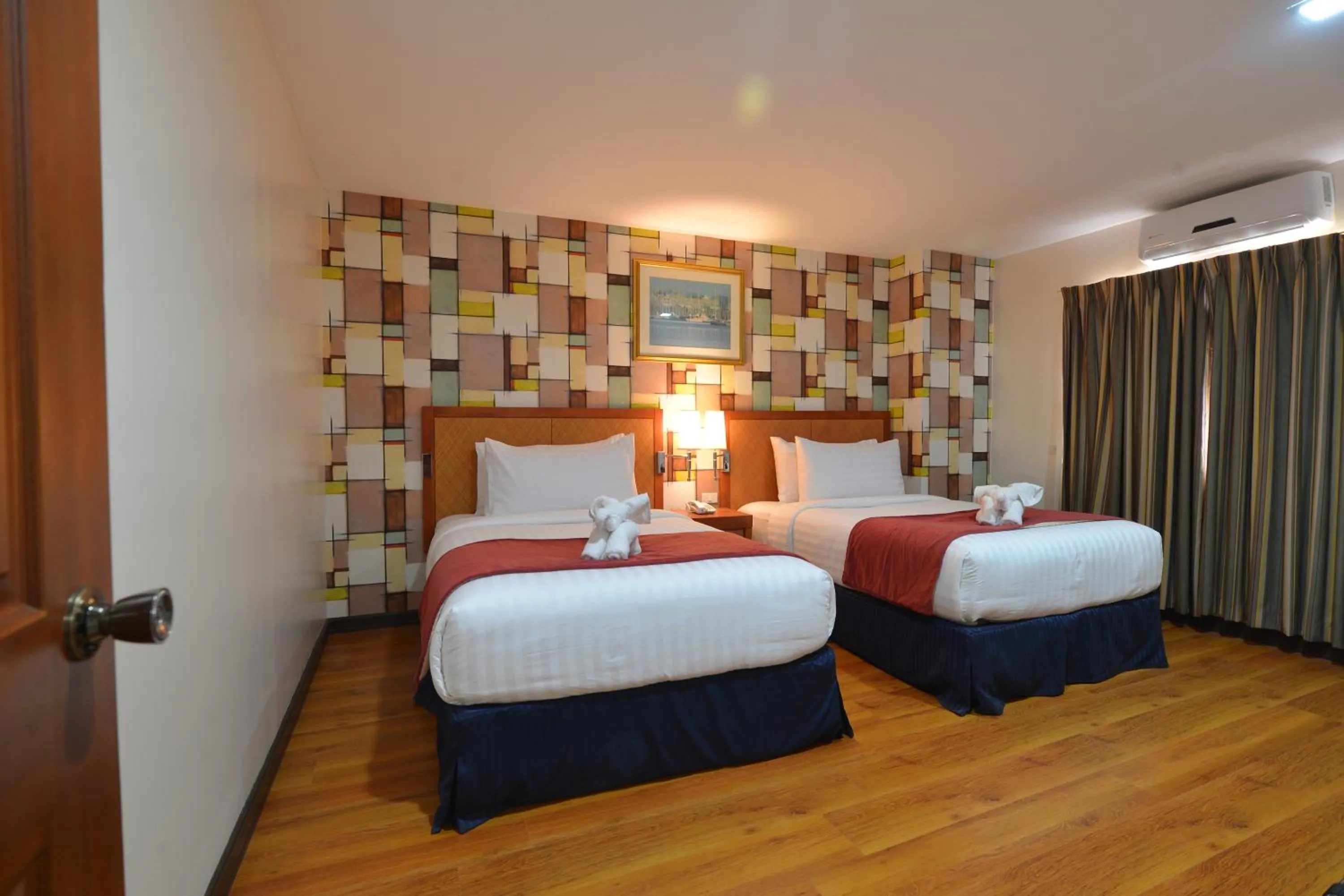 Bed in Royal Suites Condotel