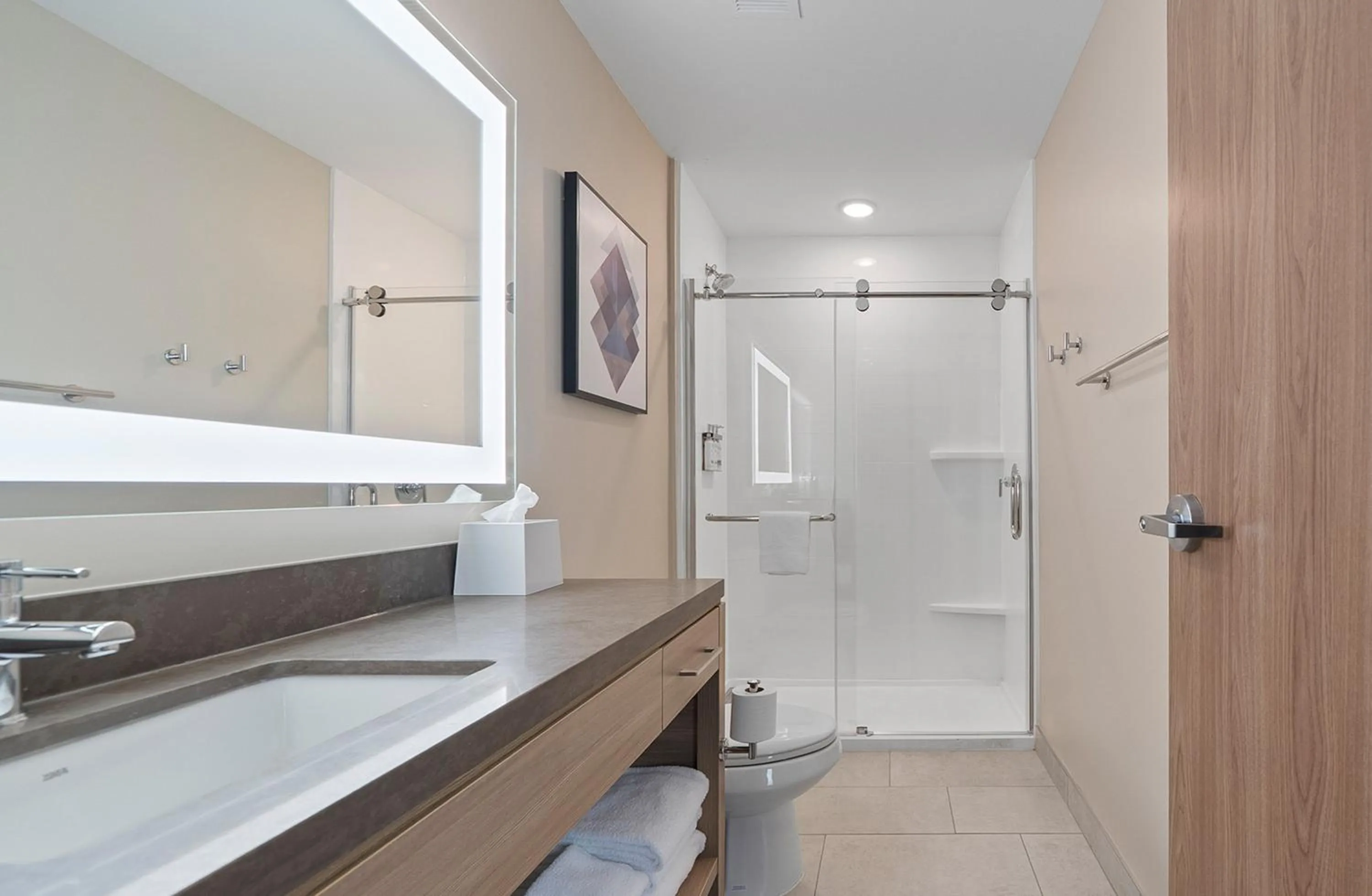 Bathroom in Candlewood Suites Perry-National Fairground Area by IHG