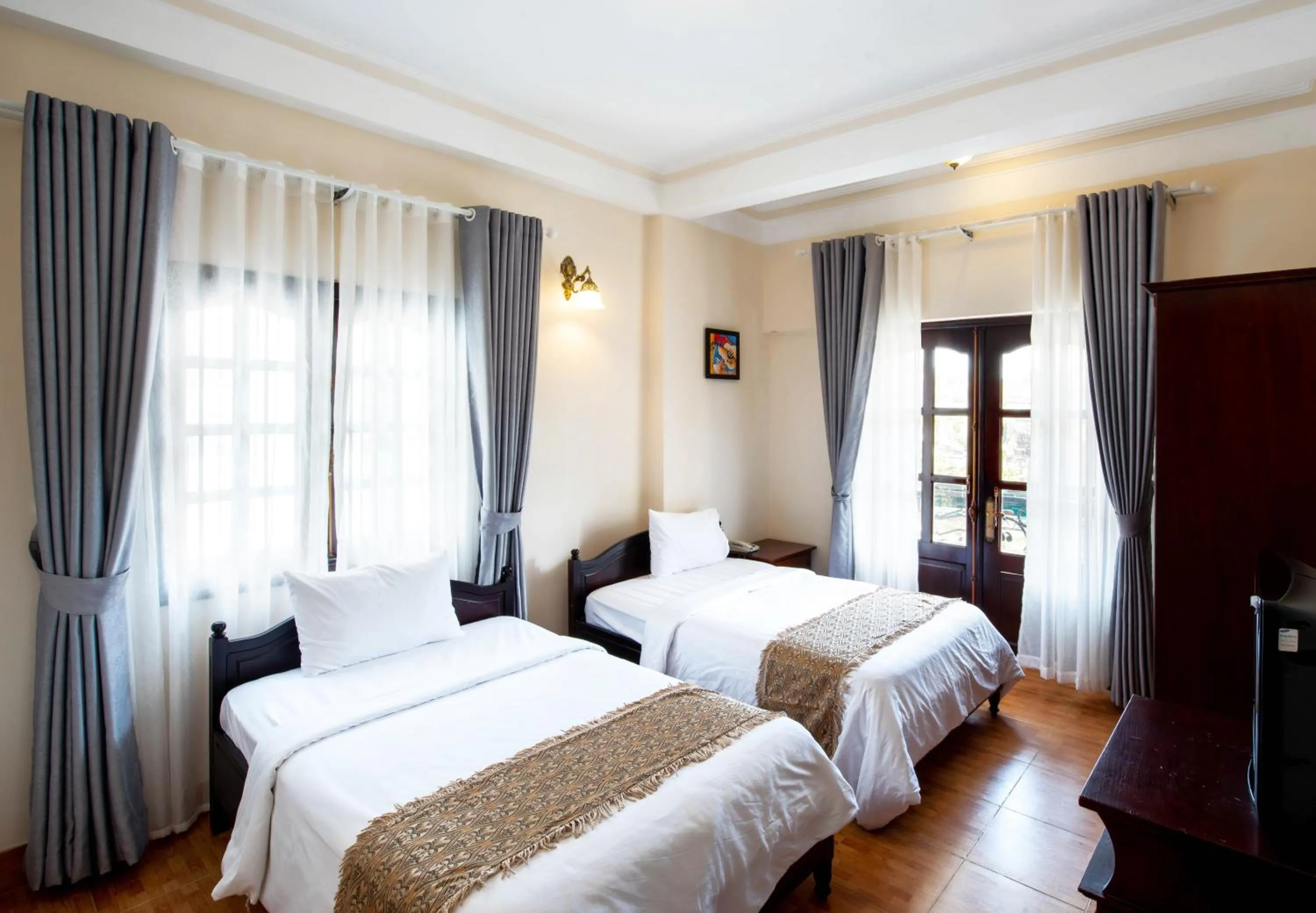 Photo of the whole room, Bed in Le Petit Paris Dalat Hotel