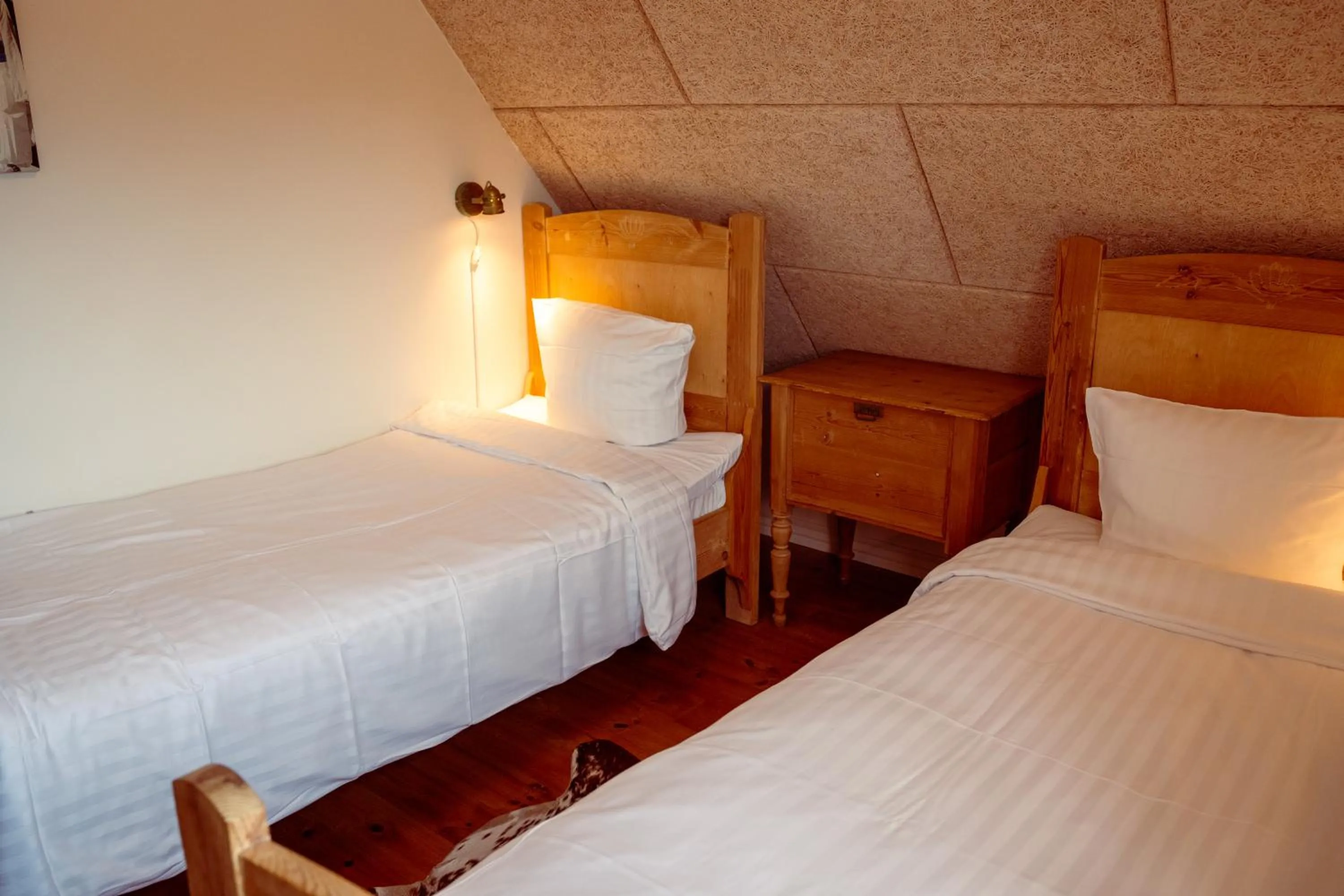 Bed in Boutique Hotel Postgården