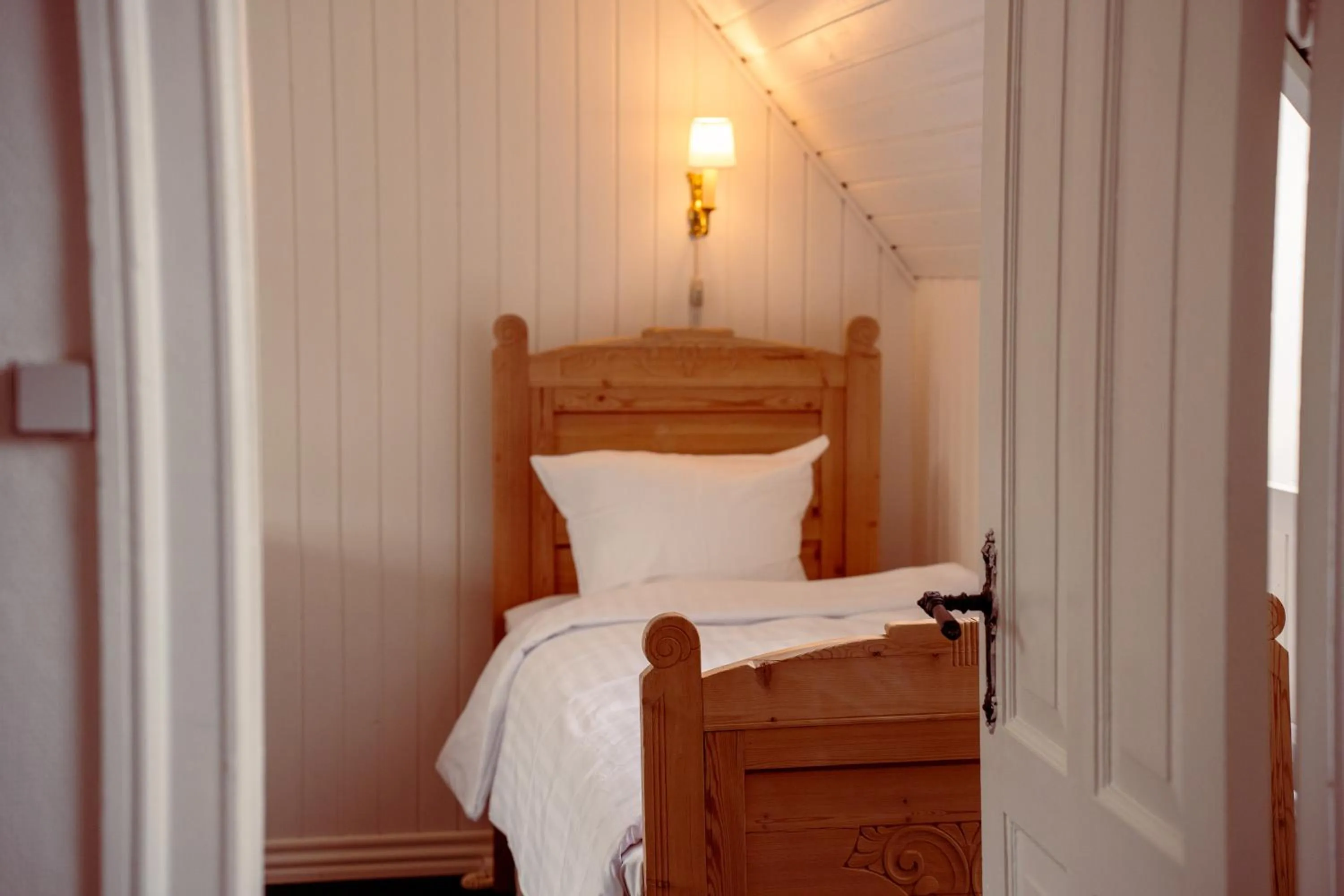 Bed in Boutique Hotel Postgården