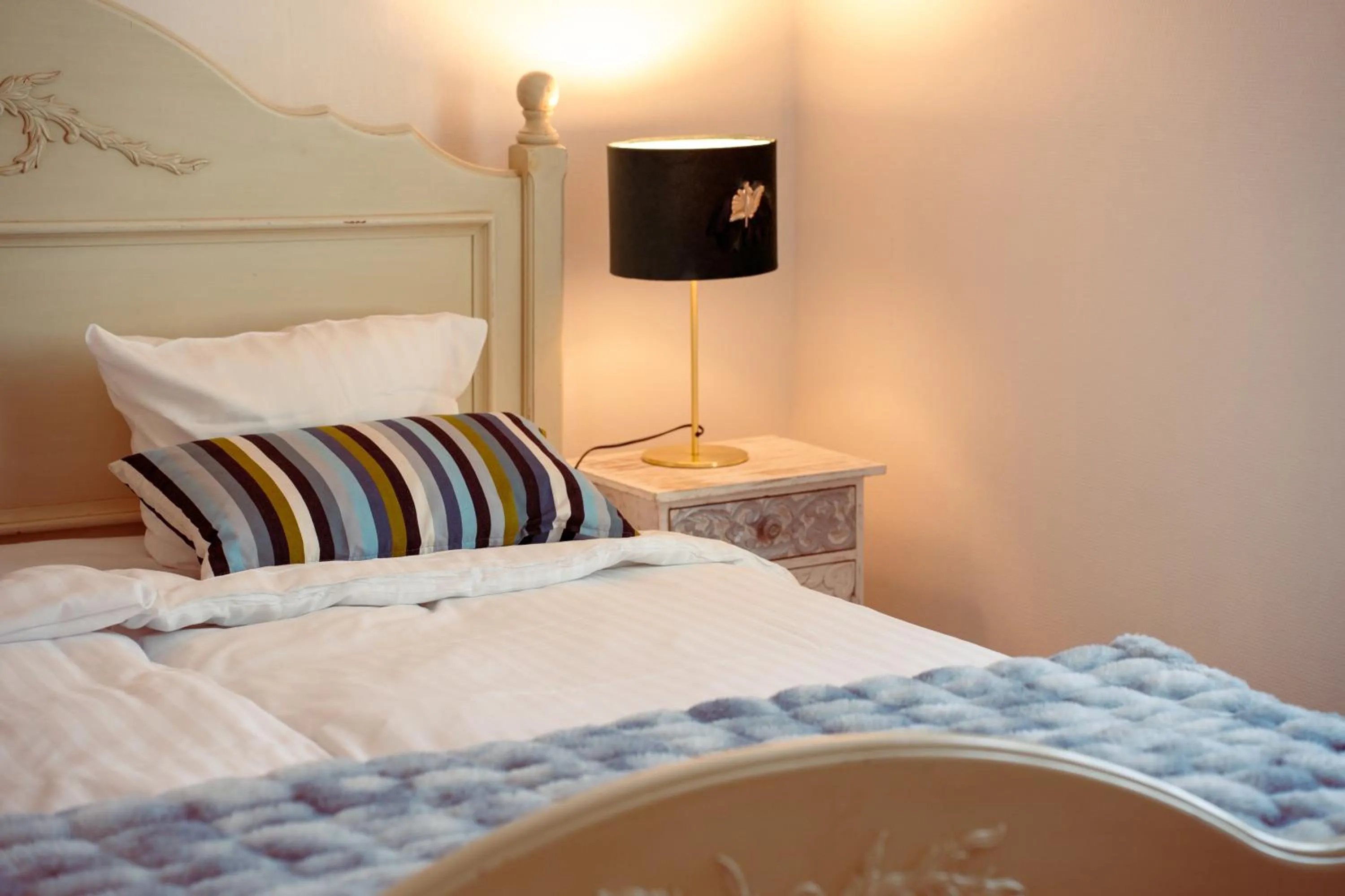 Bed in Boutique Hotel Postgården