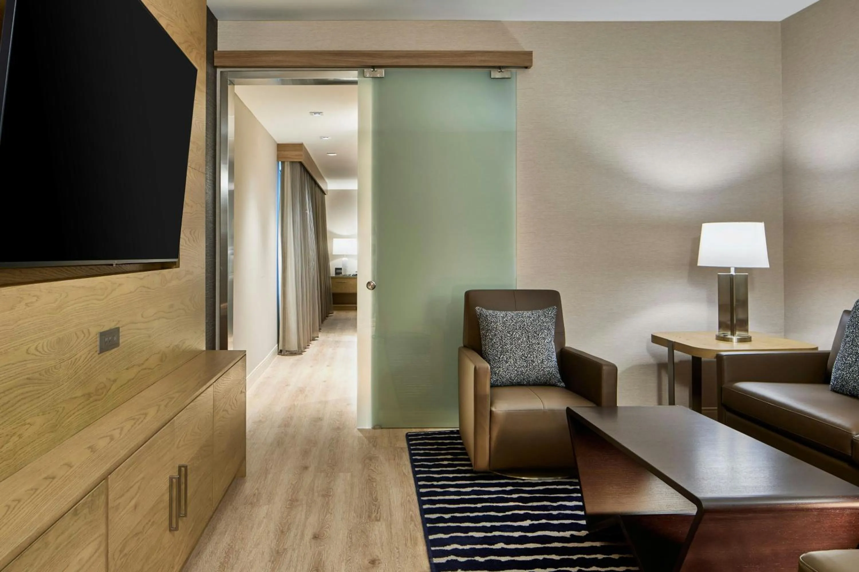 Living room in AC Hotel Savannah Historic District