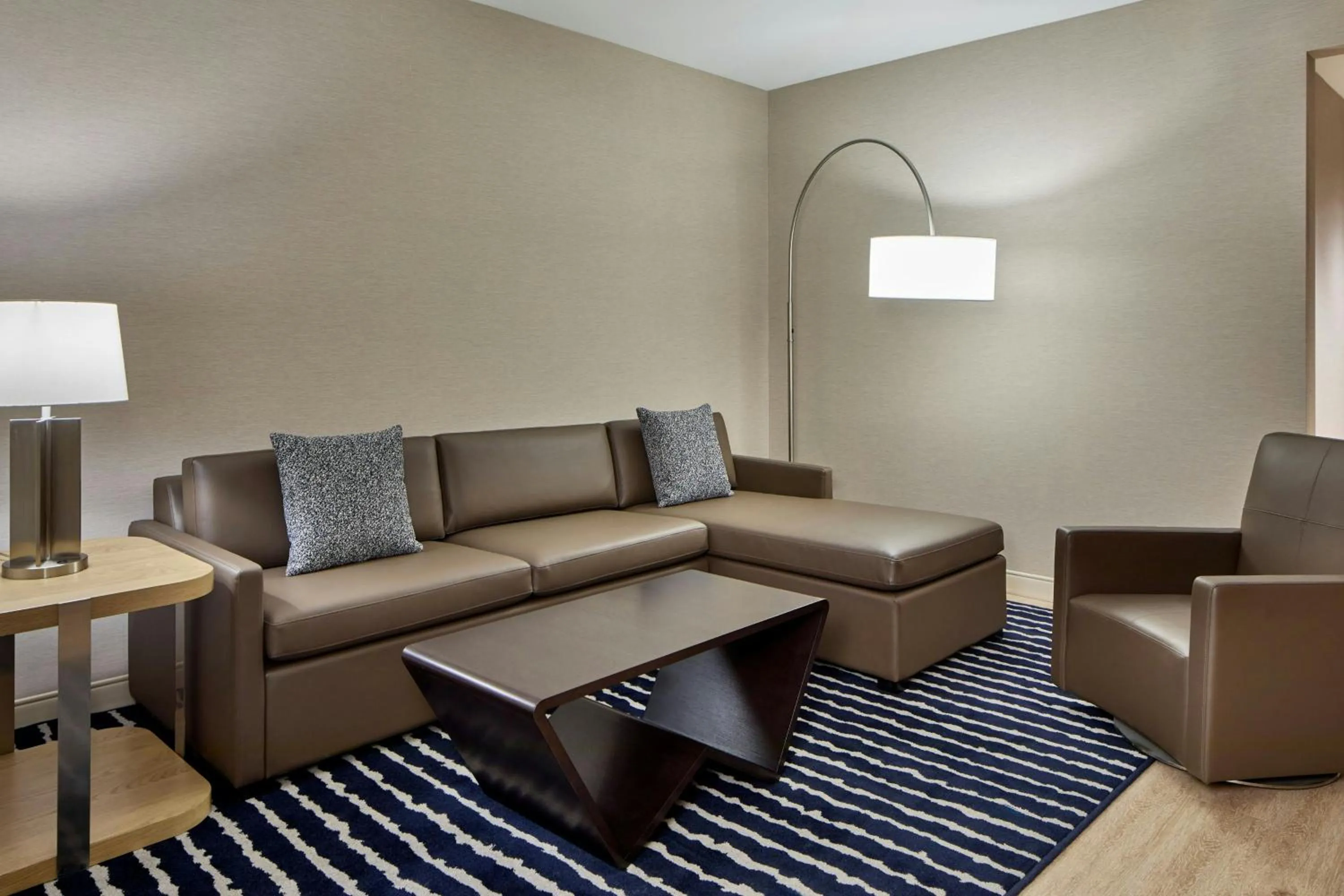 Living room in AC Hotel Savannah Historic District