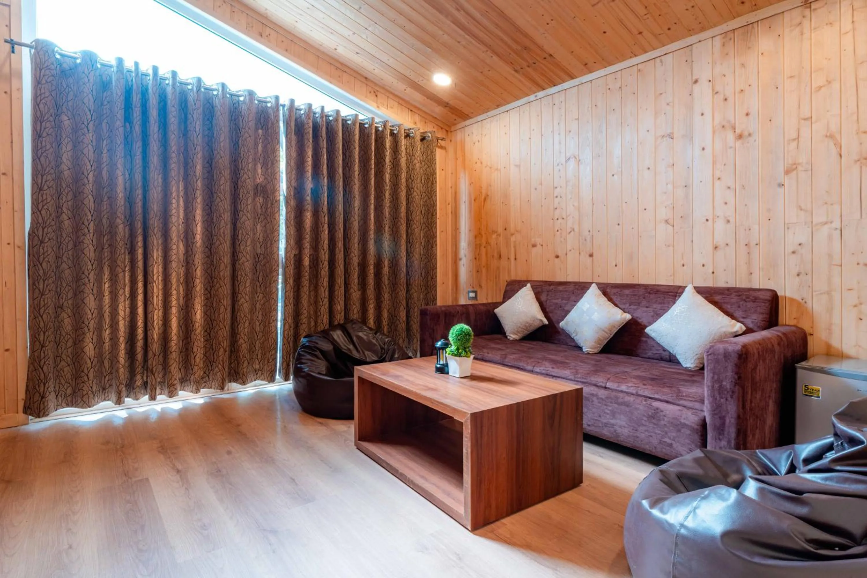 Seating area in Treebo Premium Mowgli's Den Pench with Swimming Pool