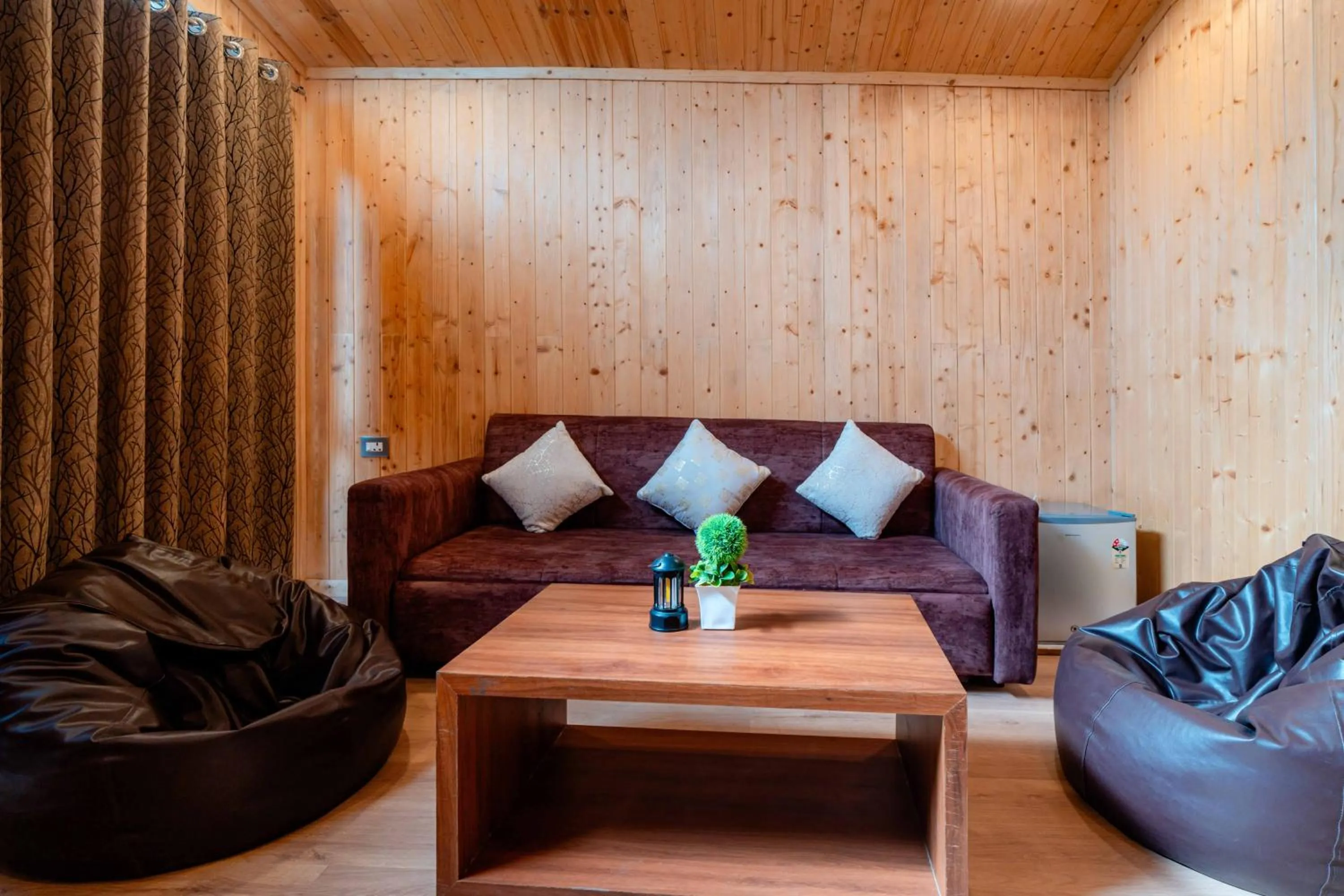 Seating area in Treebo Premium Mowgli's Den Pench with Swimming Pool