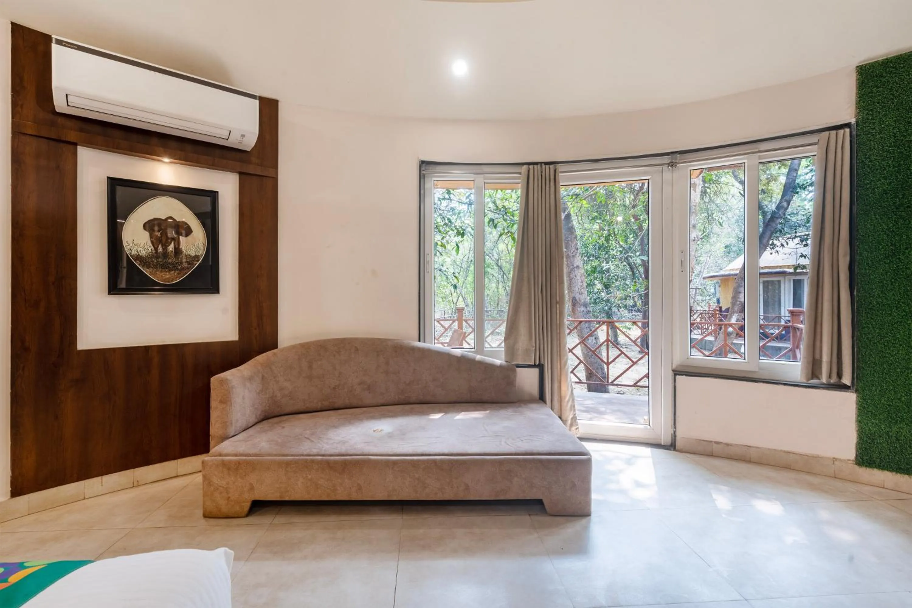 Seating area, Bed in Treebo Premium Mowgli's Den Pench with Swimming Pool