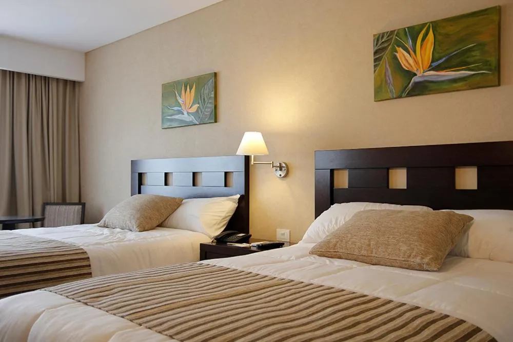 Bed in Howard Johnson Hotel & Resort Funes