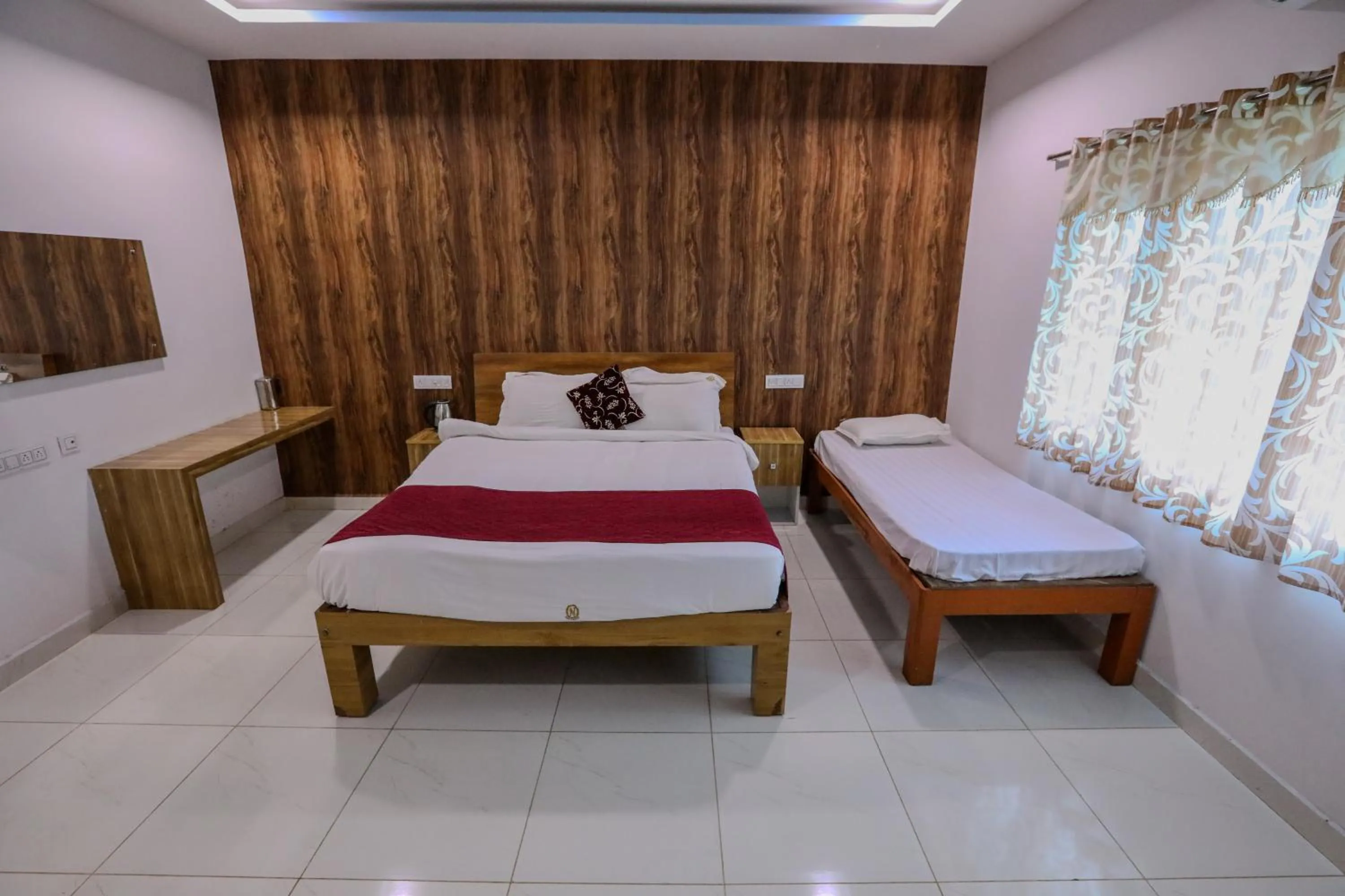 Bed in Thavika O Nila Resort & Convention Centre
