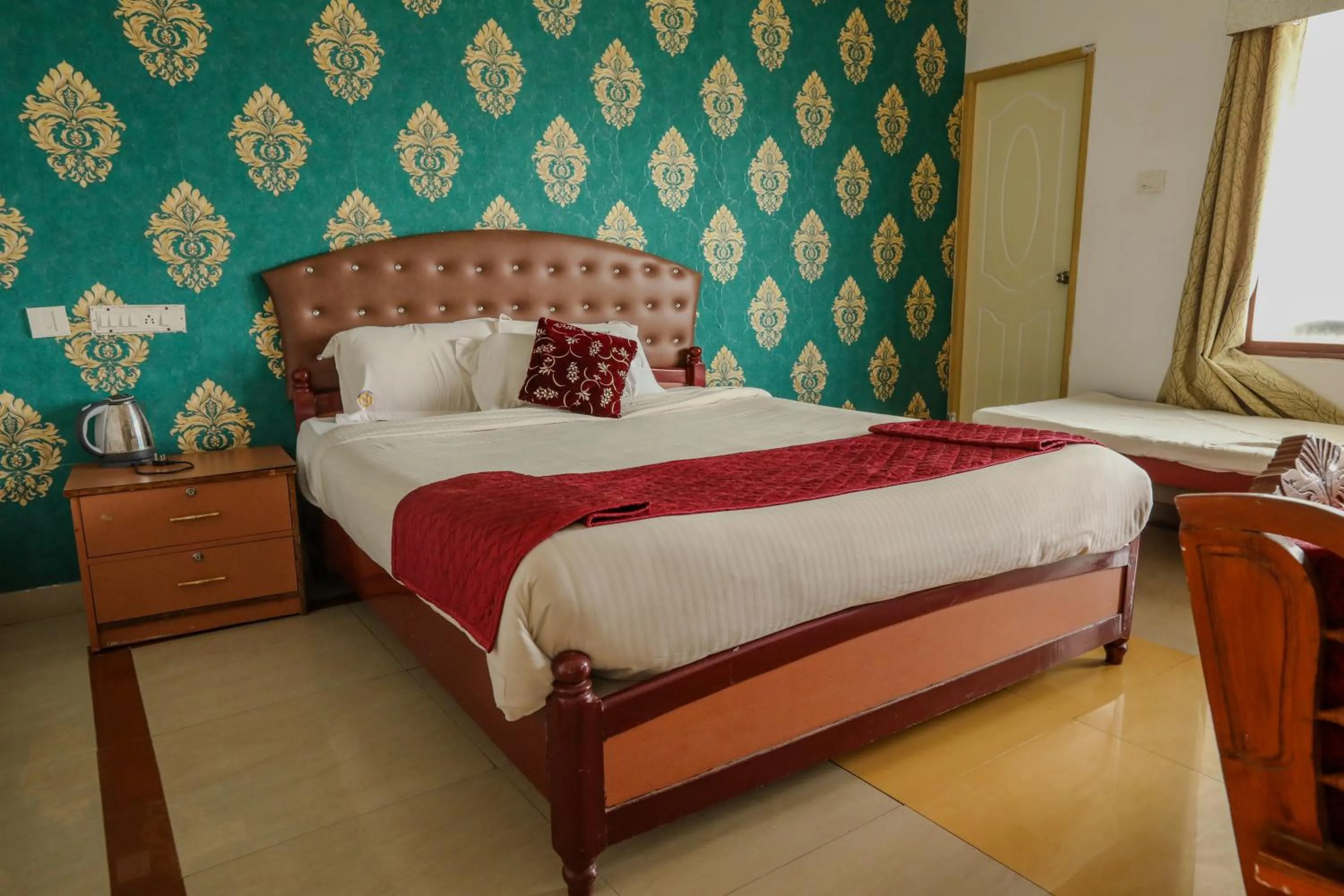 Bed in Thavika O Nila Resort & Convention Centre