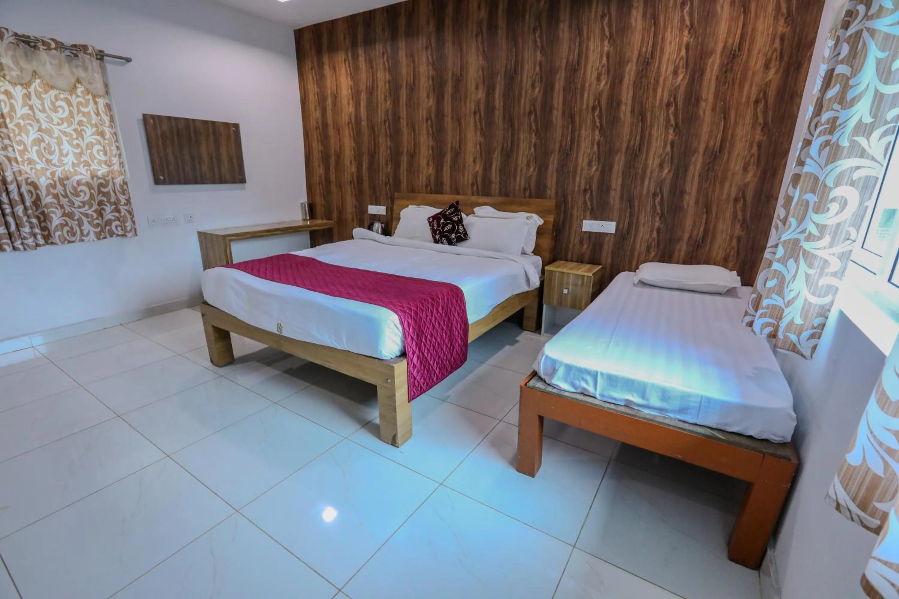 Bed in Thavika O Nila Resort & Convention Centre