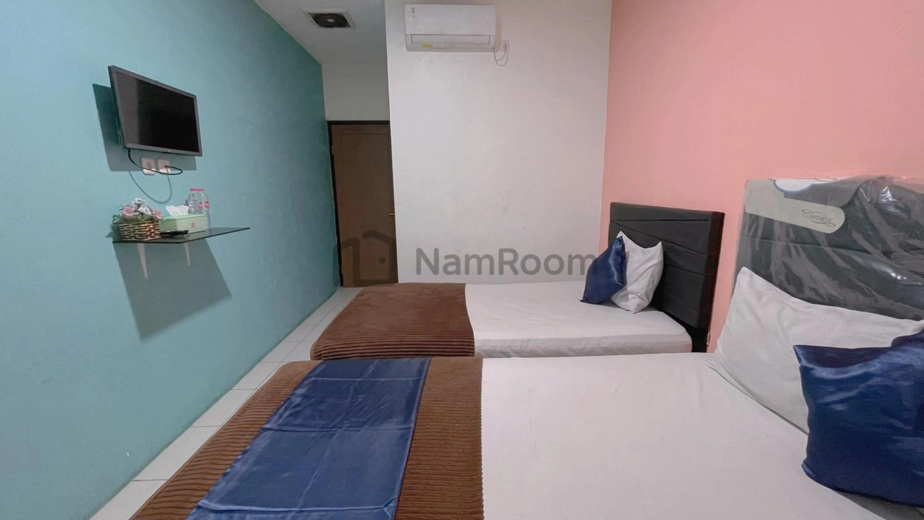 Bed in Cempaka Residence By NamRoom