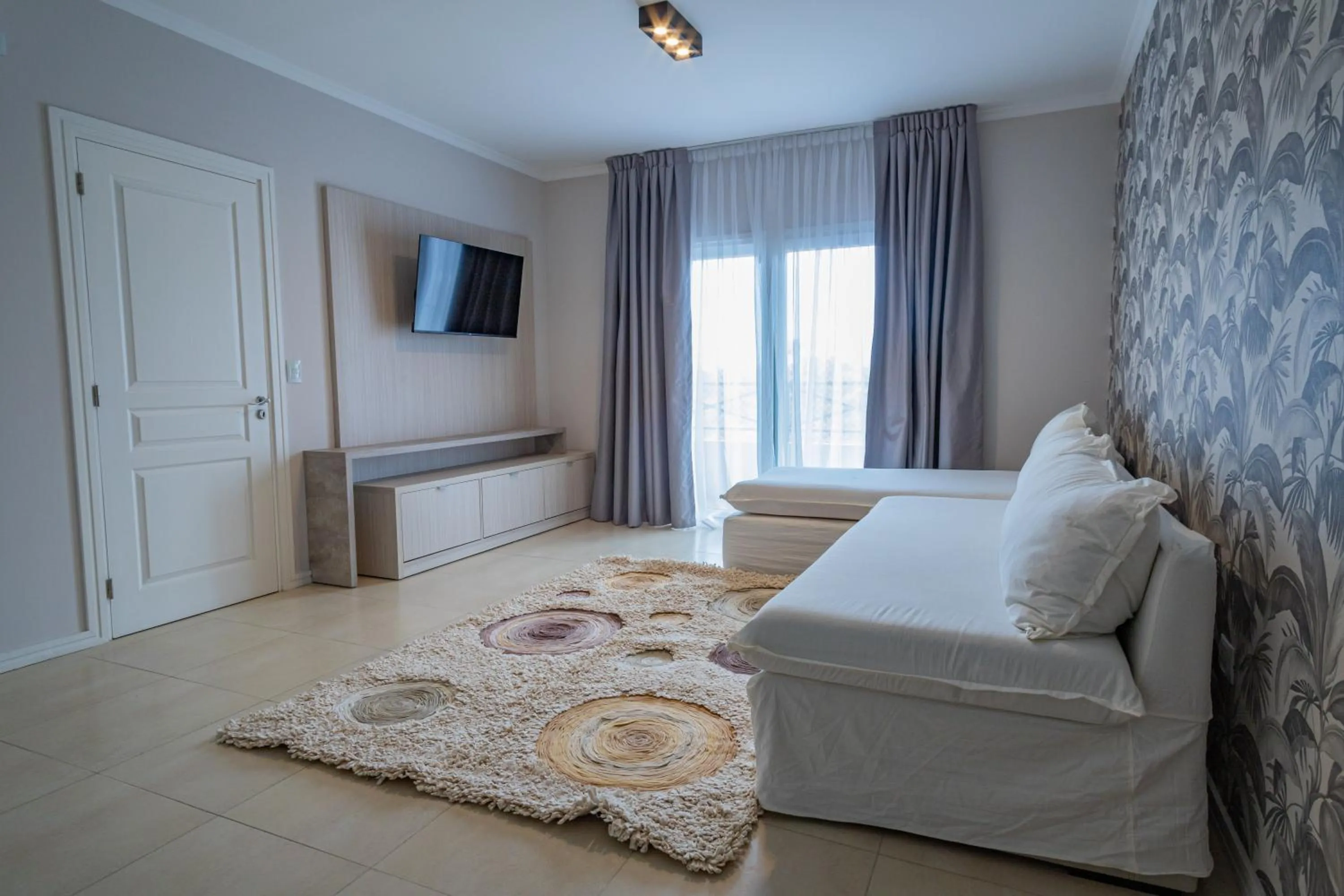 Living room, Bed in Garden Suites Pinamar