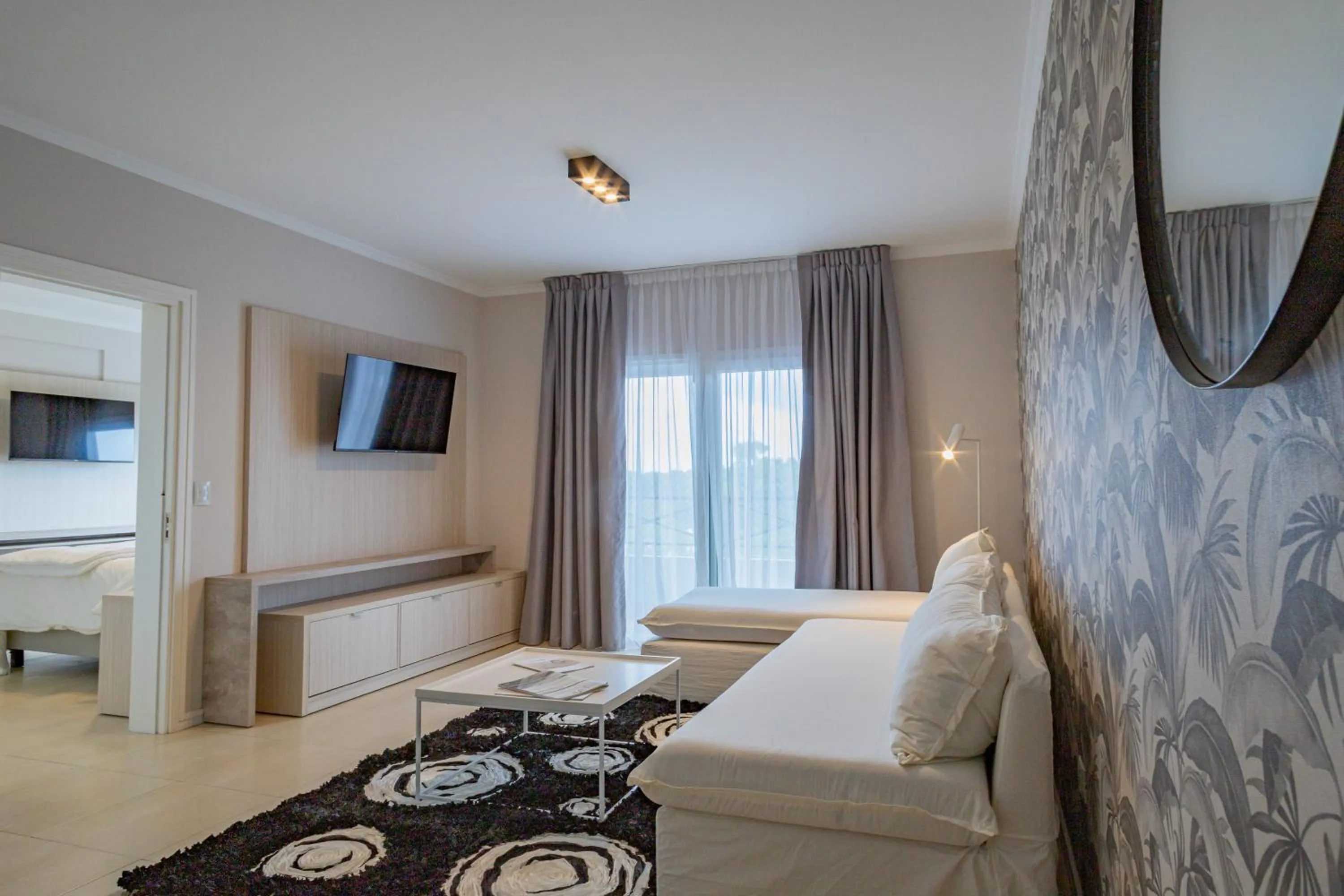 Living room, Bed in Garden Suites Pinamar