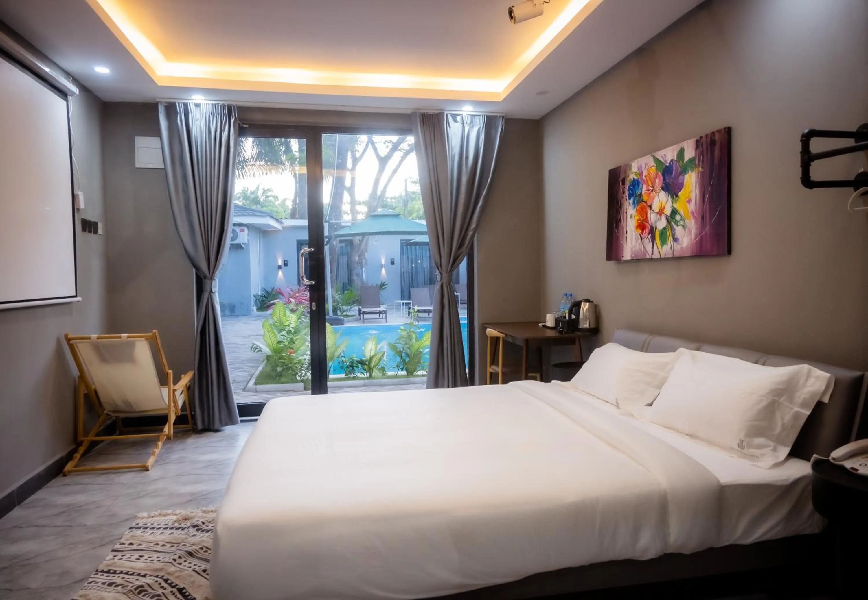 Swimming pool, Bed in The L Boutique Tz