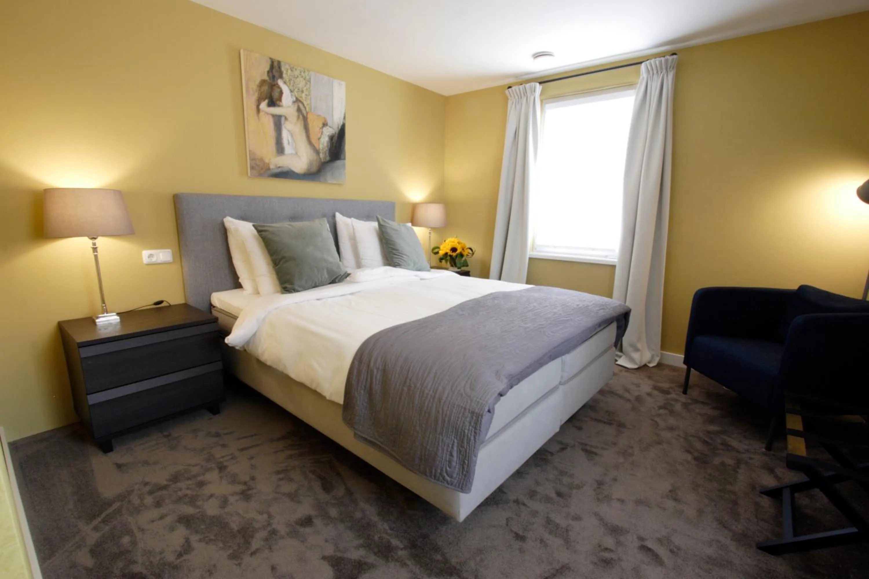 Bed in In de Witte Dame Hotel Bar Kitchen Apartments