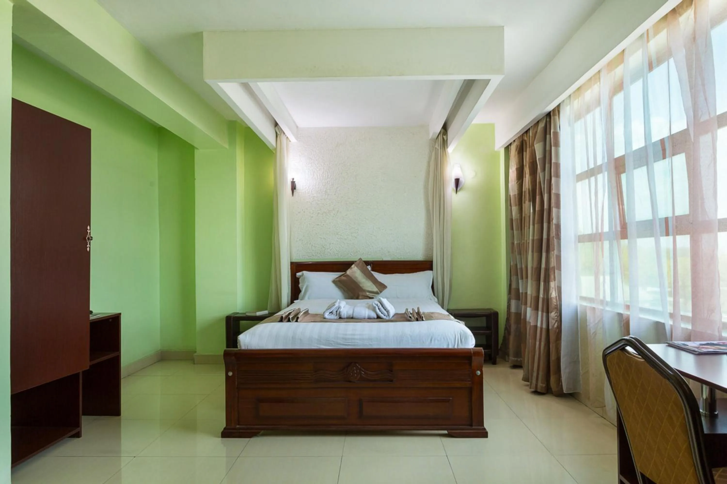 Bed in Legacy Hotel and Conference Centre ltd