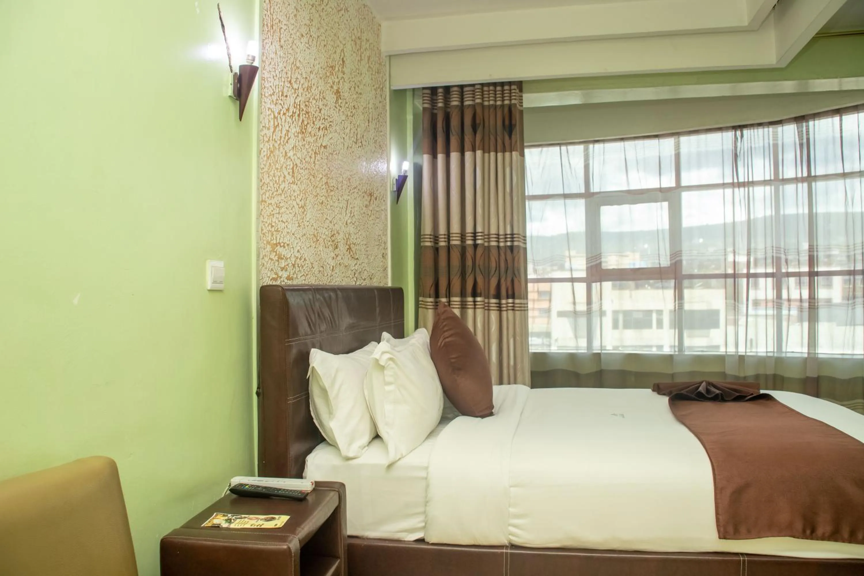 Bed in Legacy Hotel and Conference Centre ltd