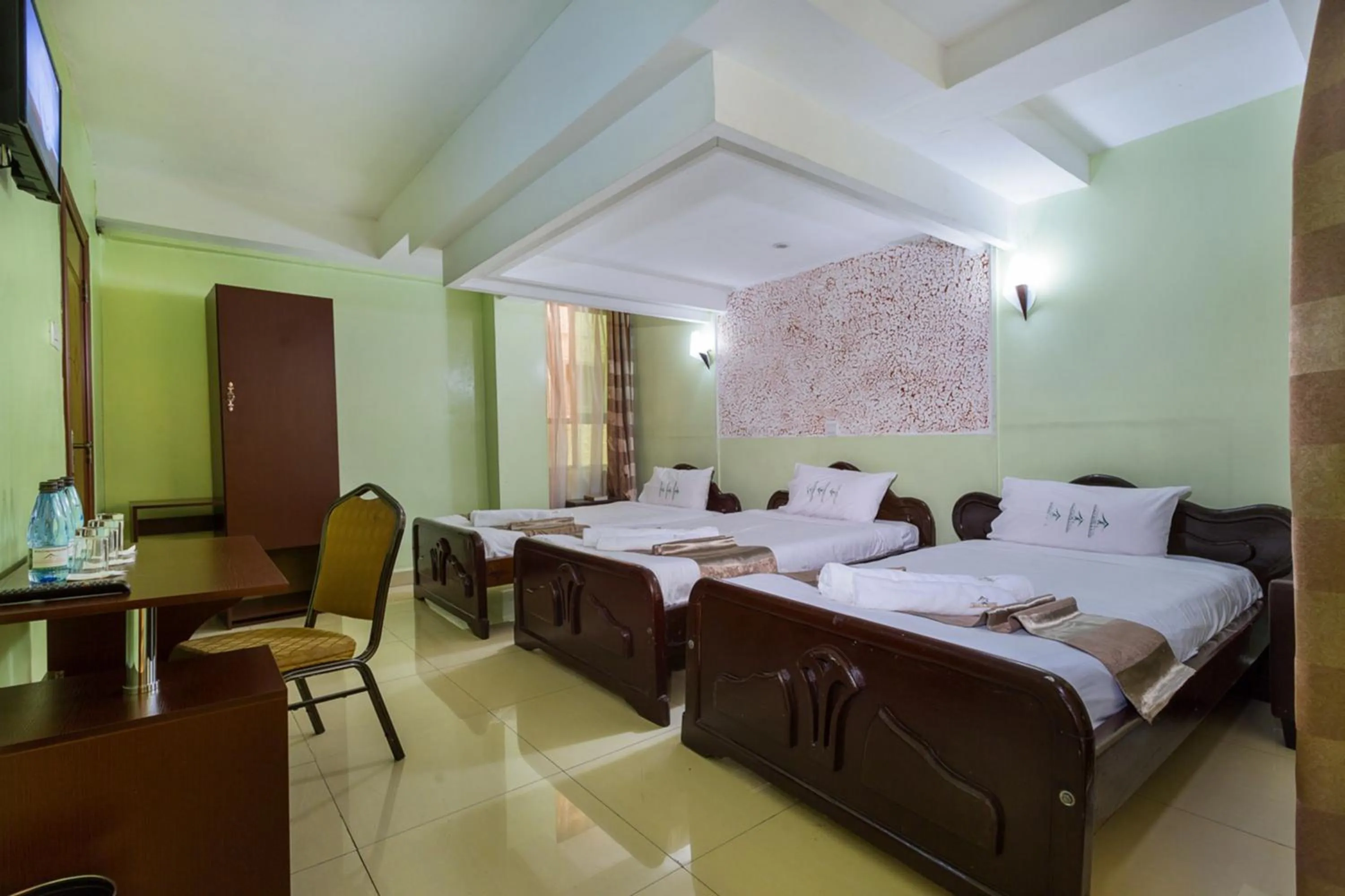 Bed in Legacy Hotel and Conference Centre ltd