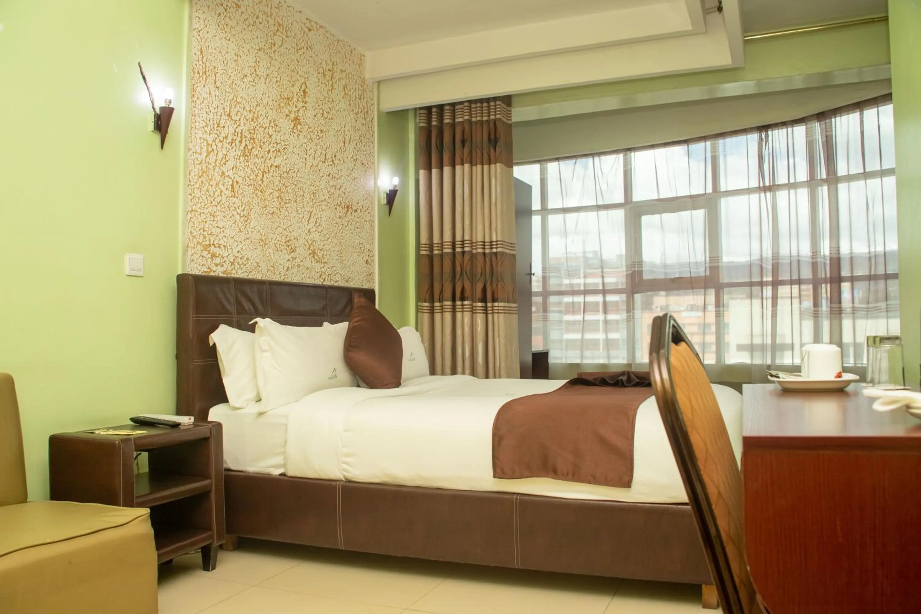 Bed in Legacy Hotel and Conference Centre ltd