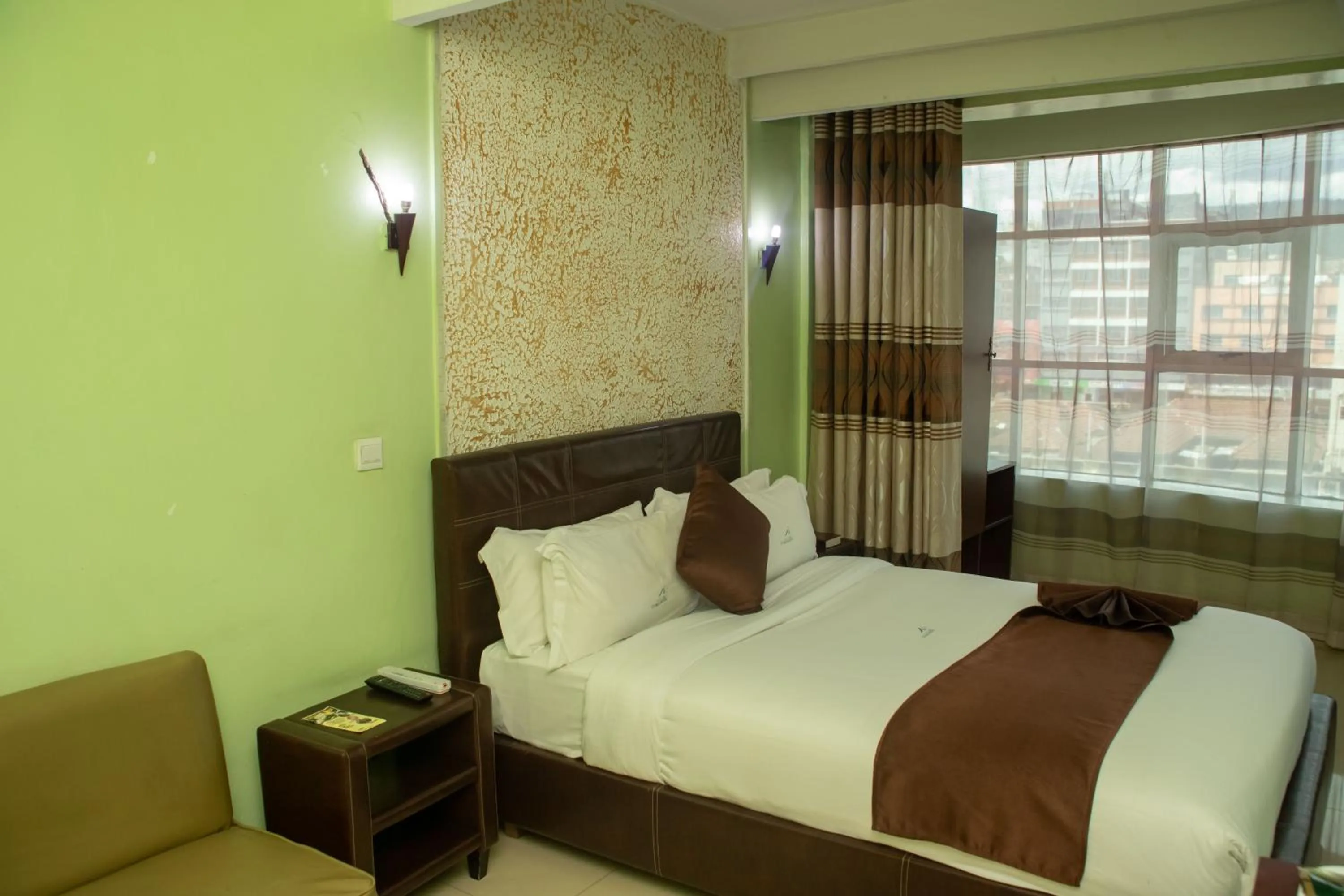 Bed in Legacy Hotel and Conference Centre ltd