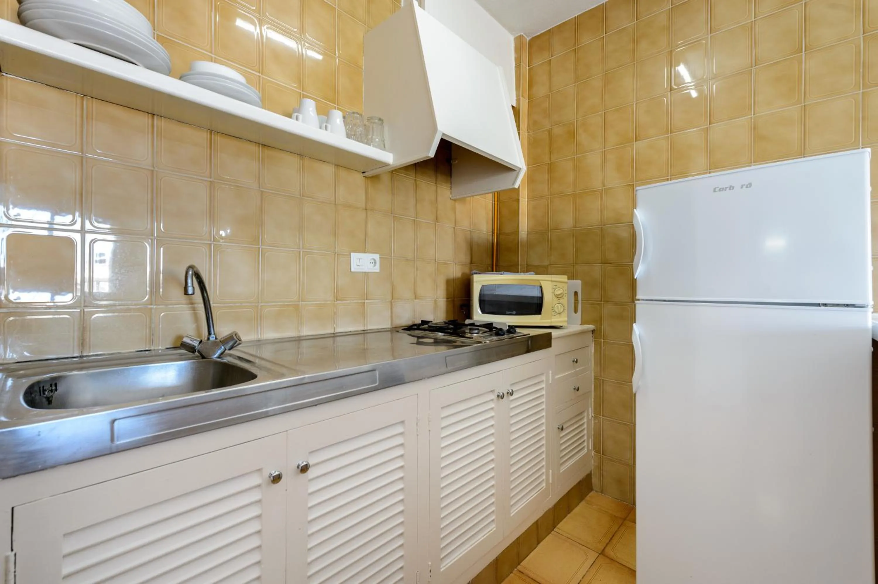 Kitchen or kitchenette in Apartamentos San Antonio Beach